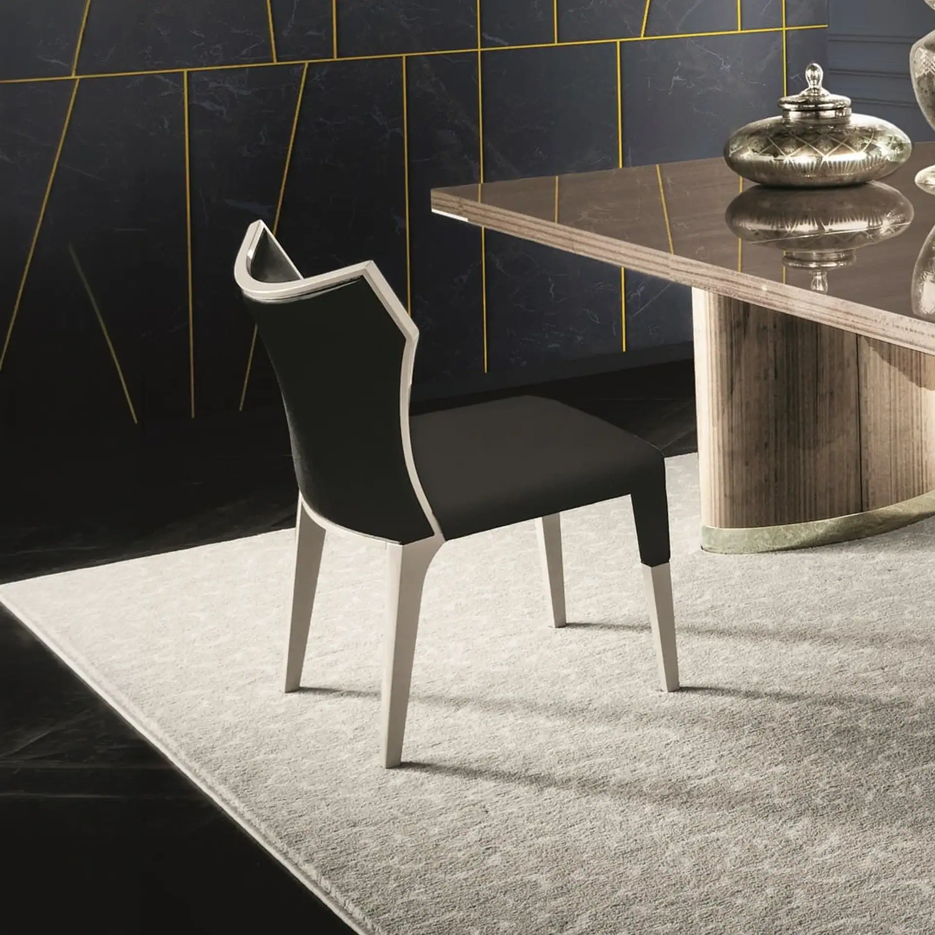 Stylish black and white dining chair with contemporary design, perfect for modern interiors.