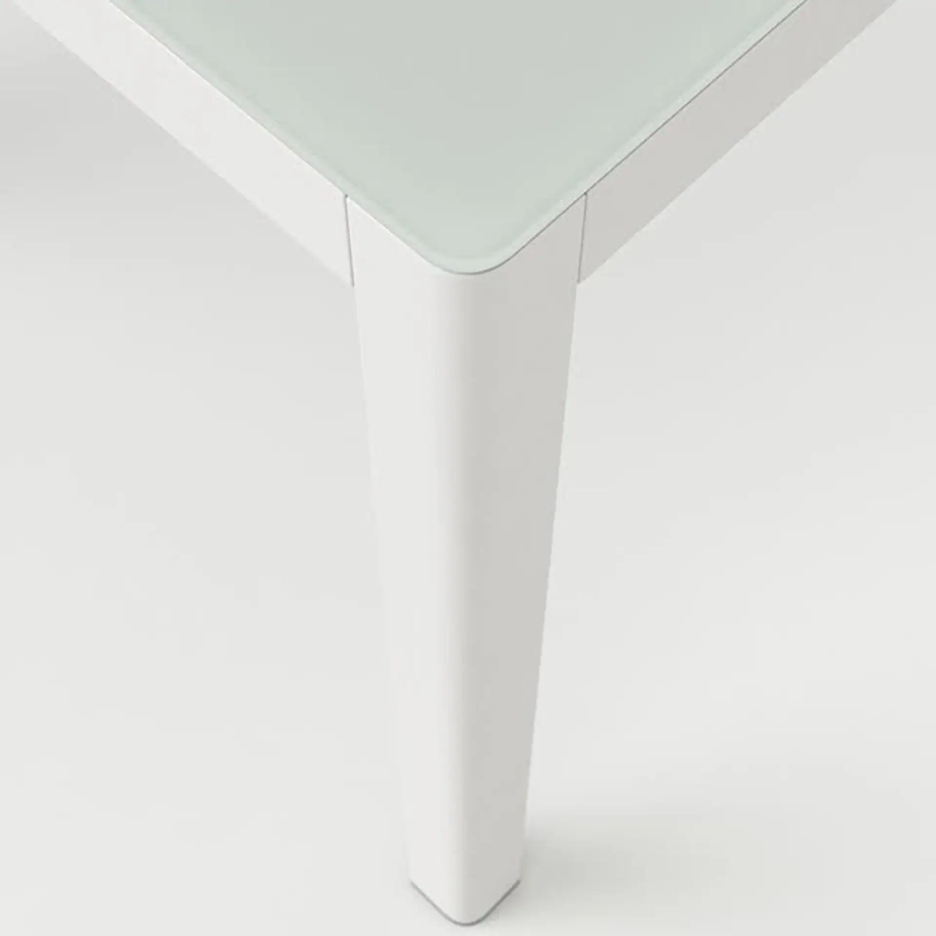 Elegant Couture Jardin Ella rectangle dining table with glass top and white finish.