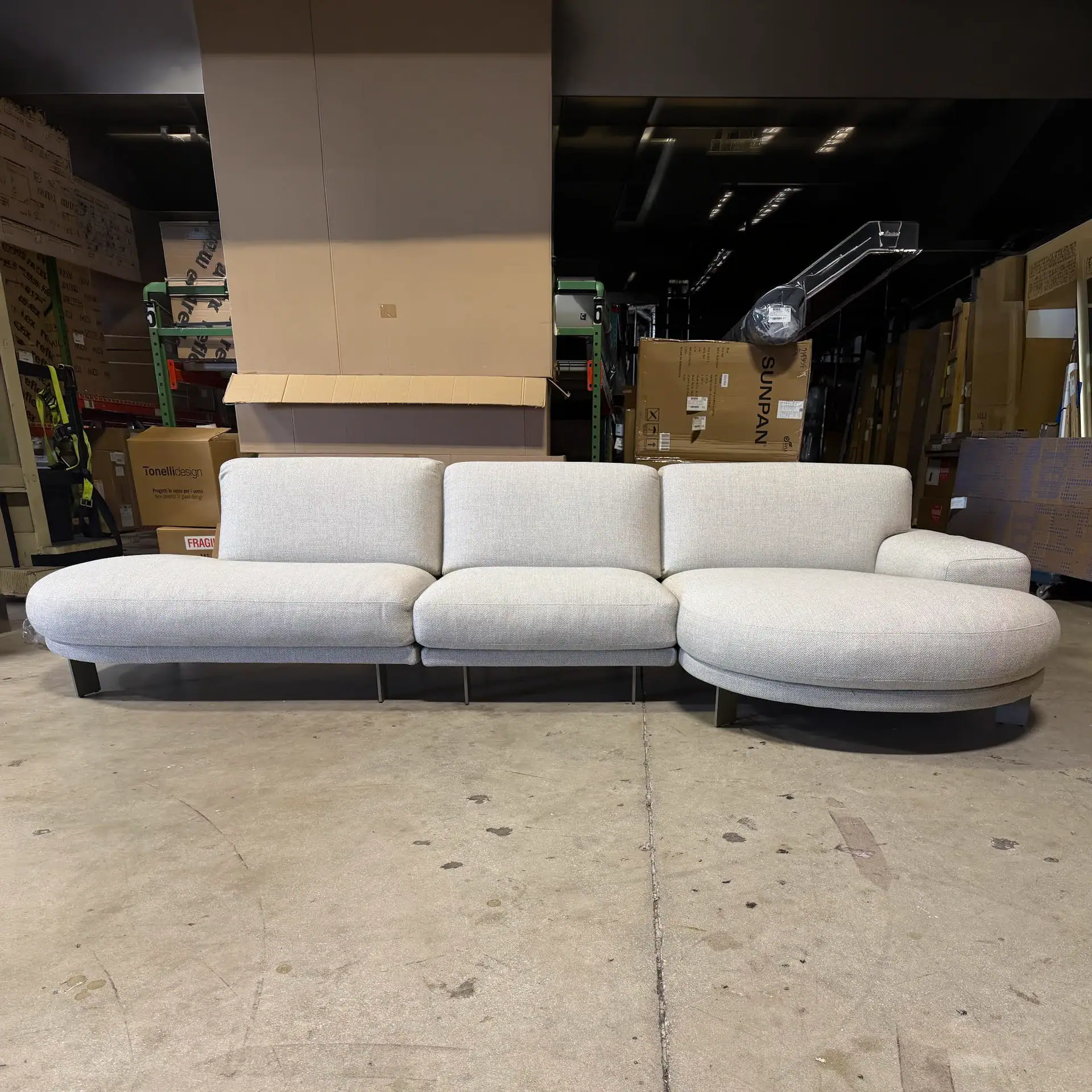 Modern Blake Low Rounded Terminal Sofa in light fabric.