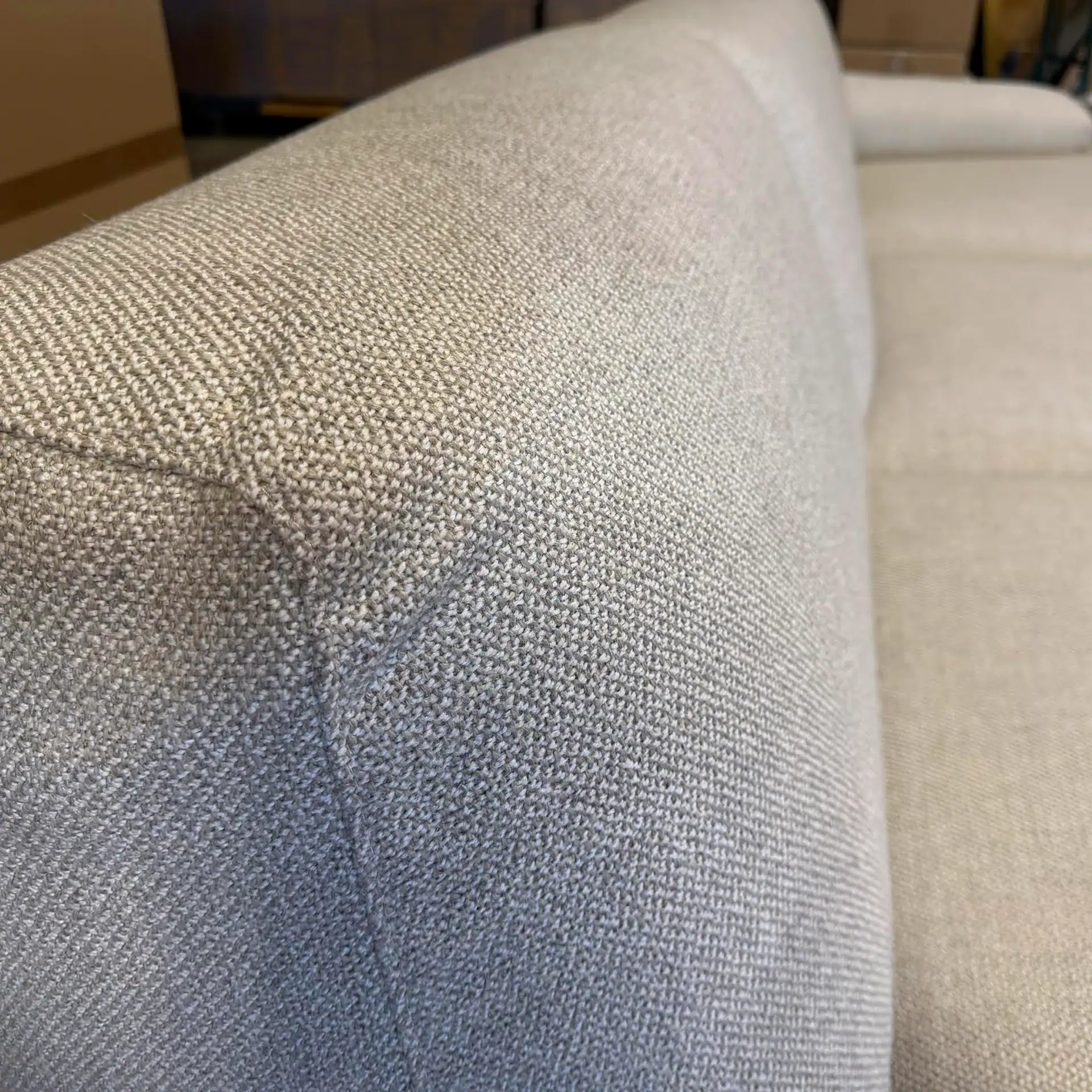 Elegant rounded sofa with plush upholstery for modern living rooms.