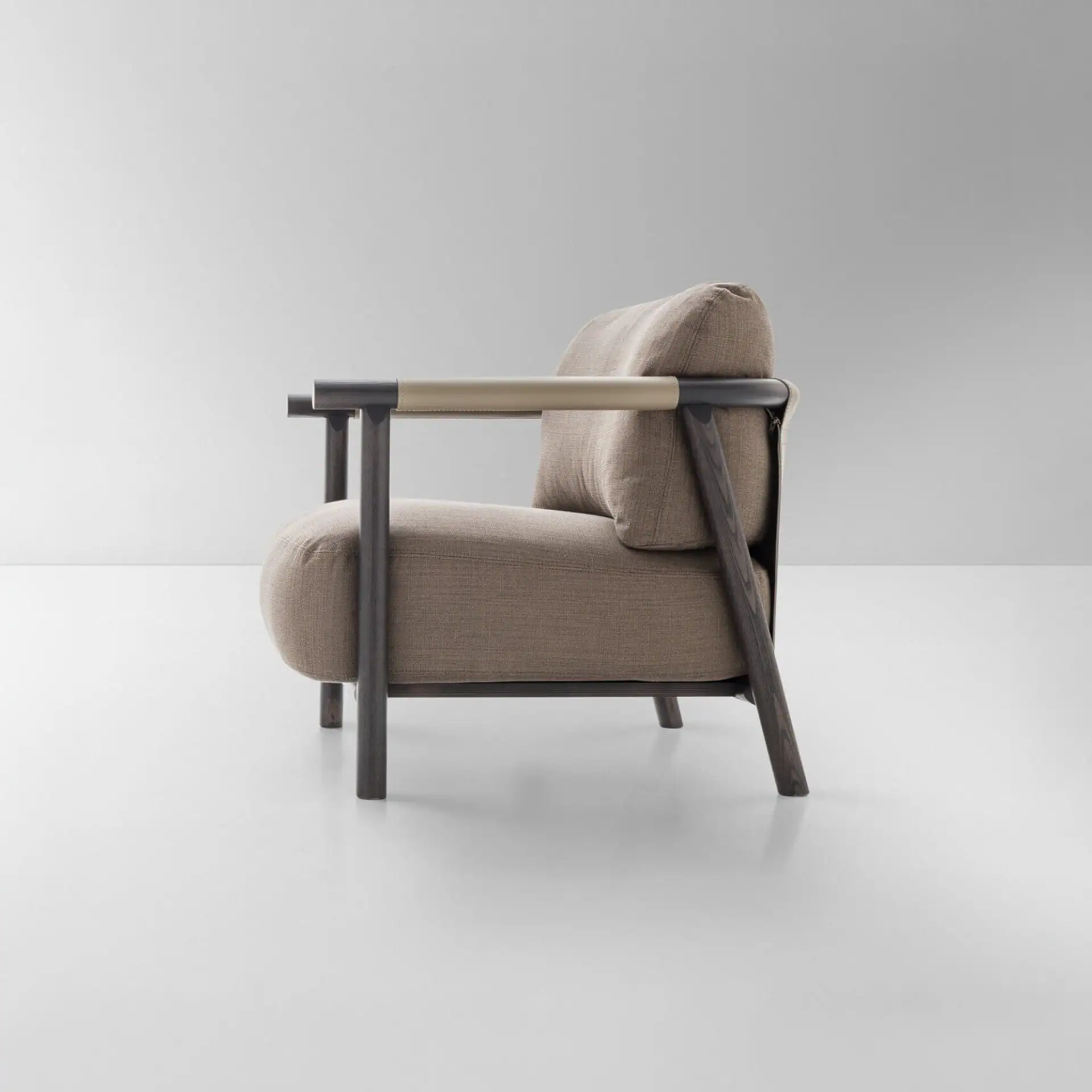 Elegant Nathy Chair with wooden frame and plush upholstery for modern living spaces.