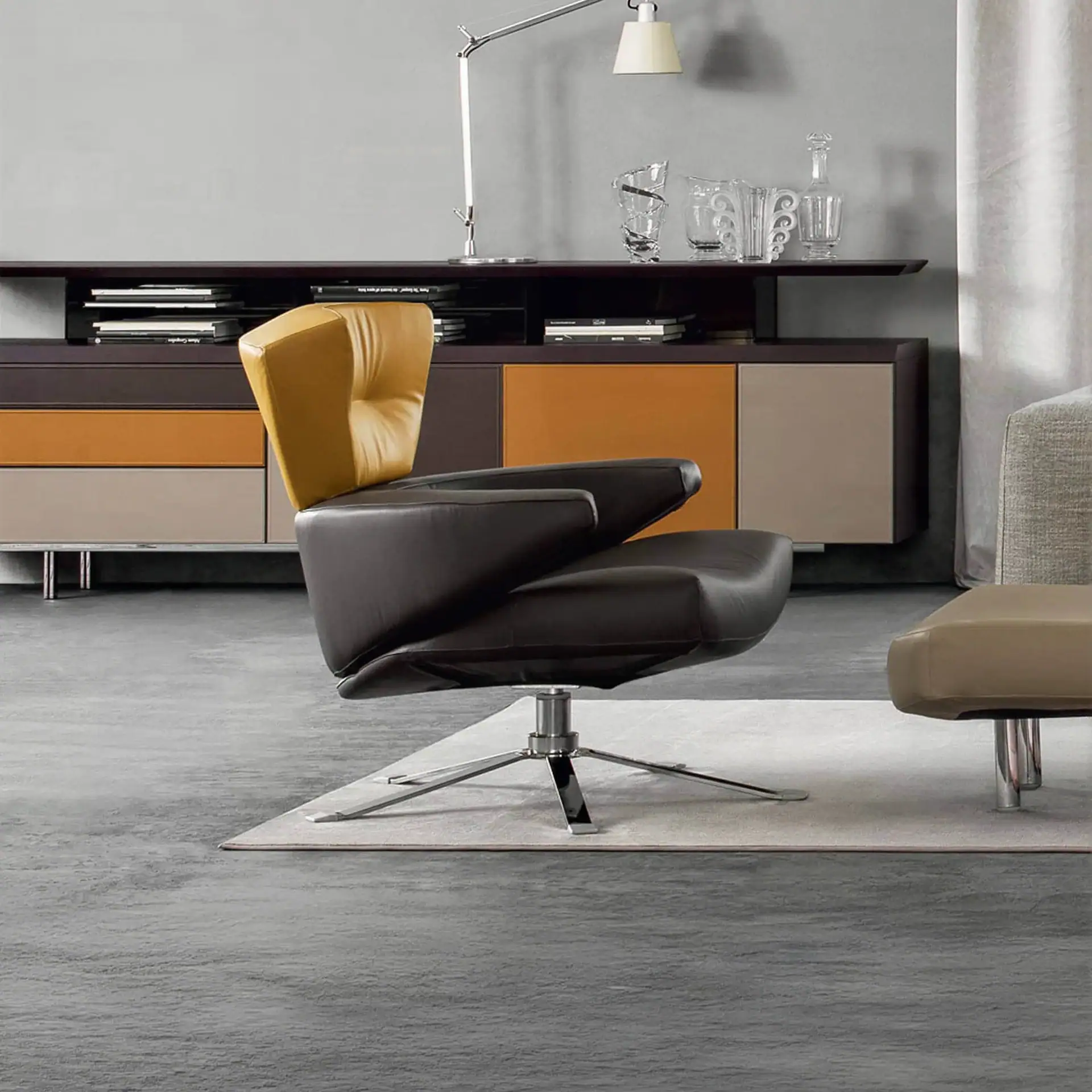 Elegant Mary Armchair with black and mustard upholstery, perfect for modern living spaces.