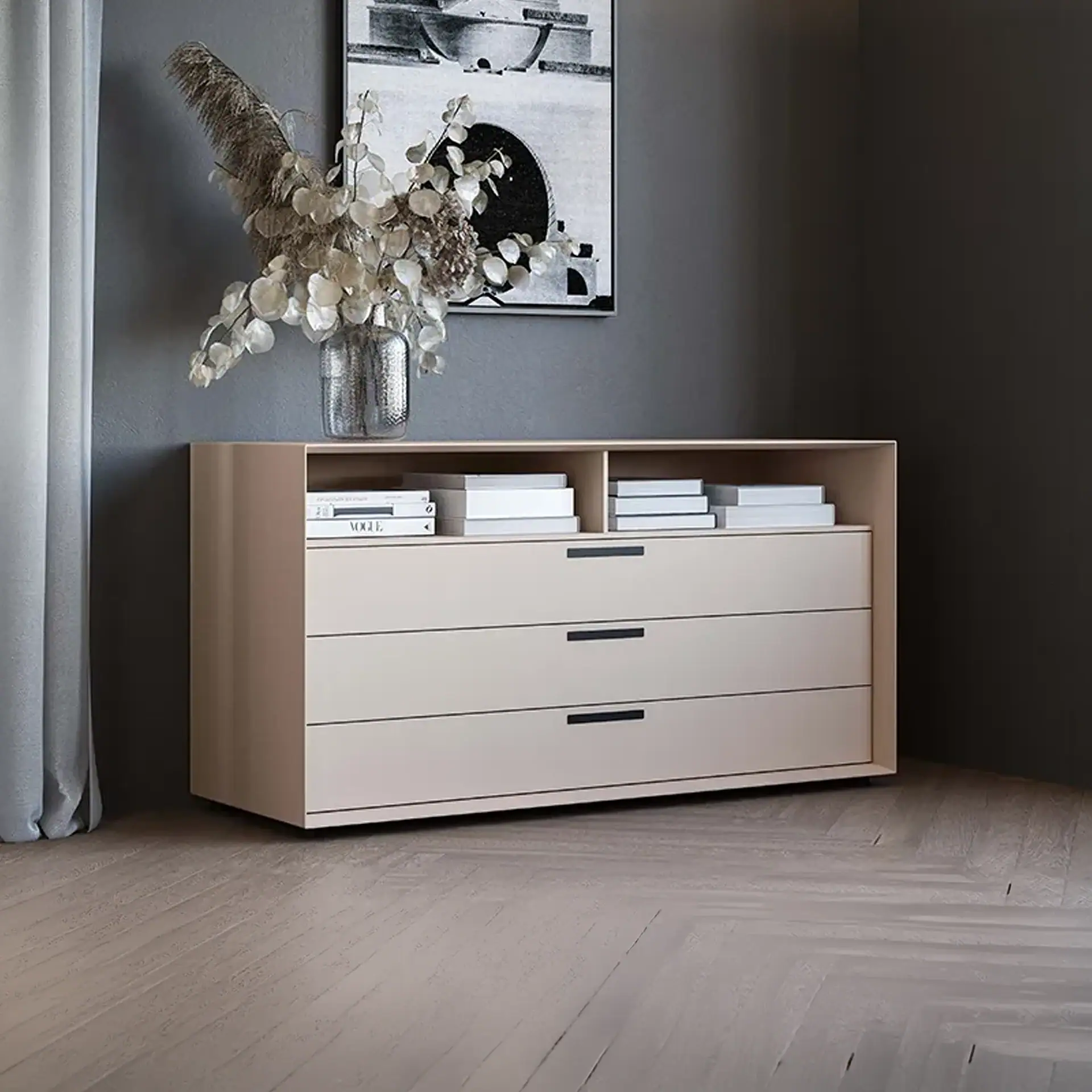 Beige wooden dresser with drawers and decorative vase, stylish home decor setup.