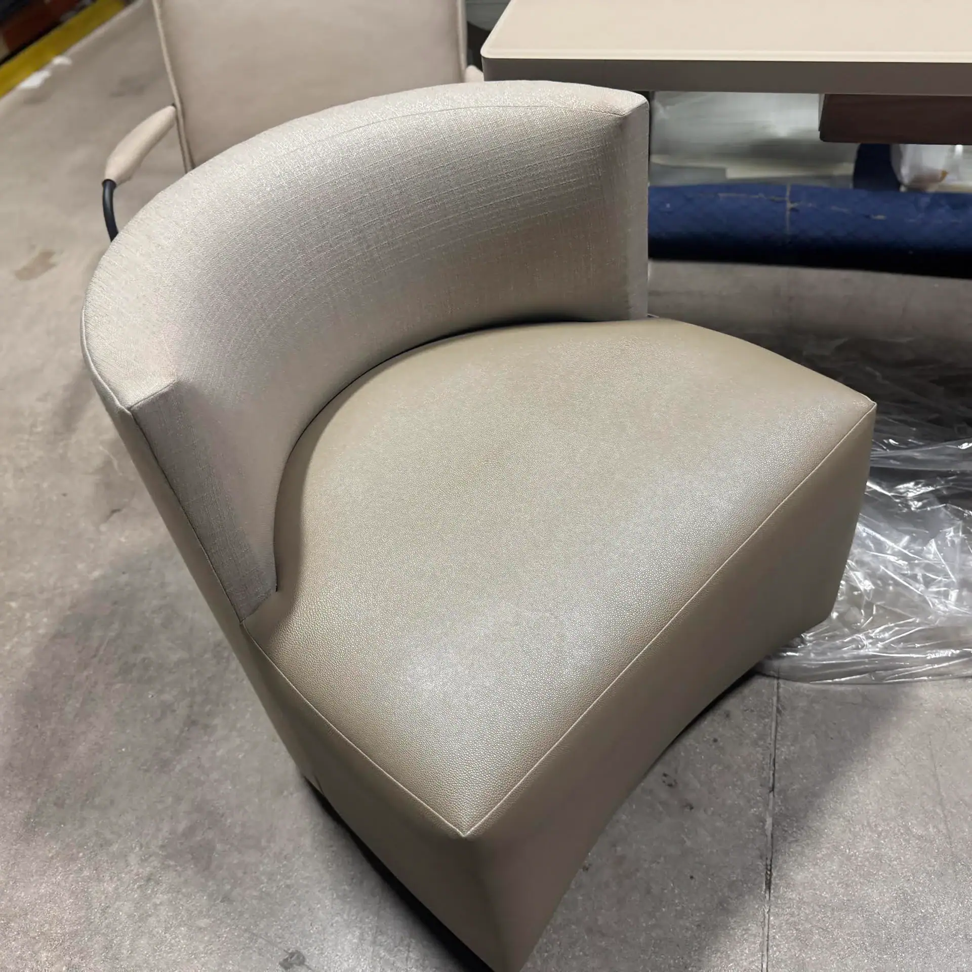 Modern Lazar Mandalay game chair with curved backrest and plush upholstery.