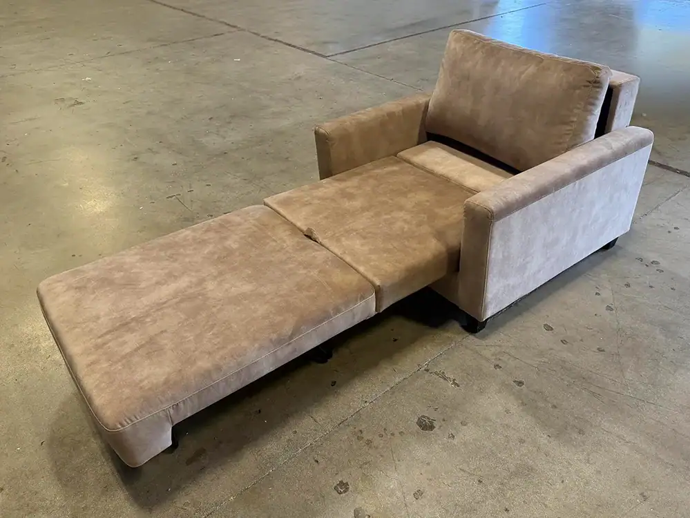 Nico Cot Sleeper Chair in beige fabric with extendable ottoman.