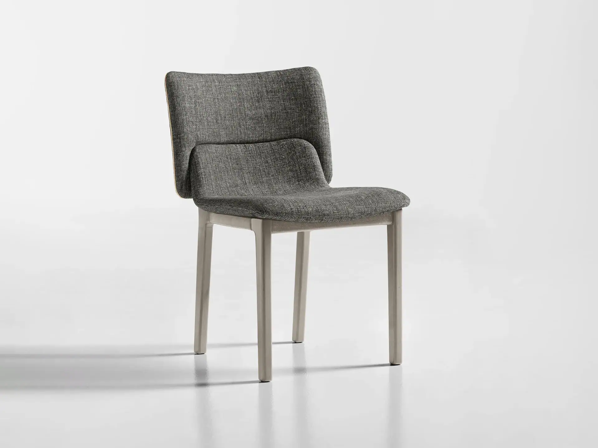 Modern gray upholstered dining chair with wooden legs, stylish and comfortable for contemporary dini.