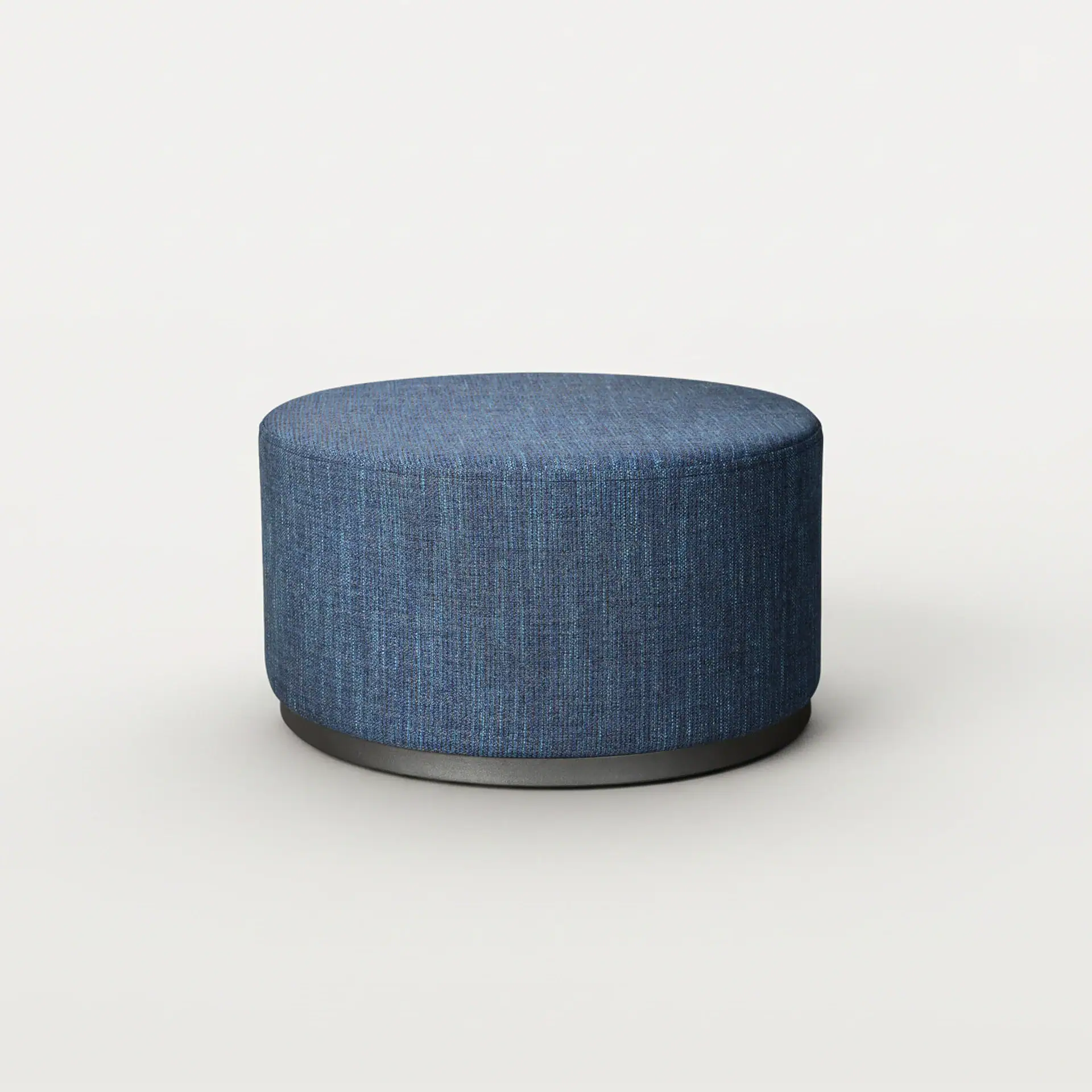 Ottoman with blue fabric upholstery, round shape, and modern design.