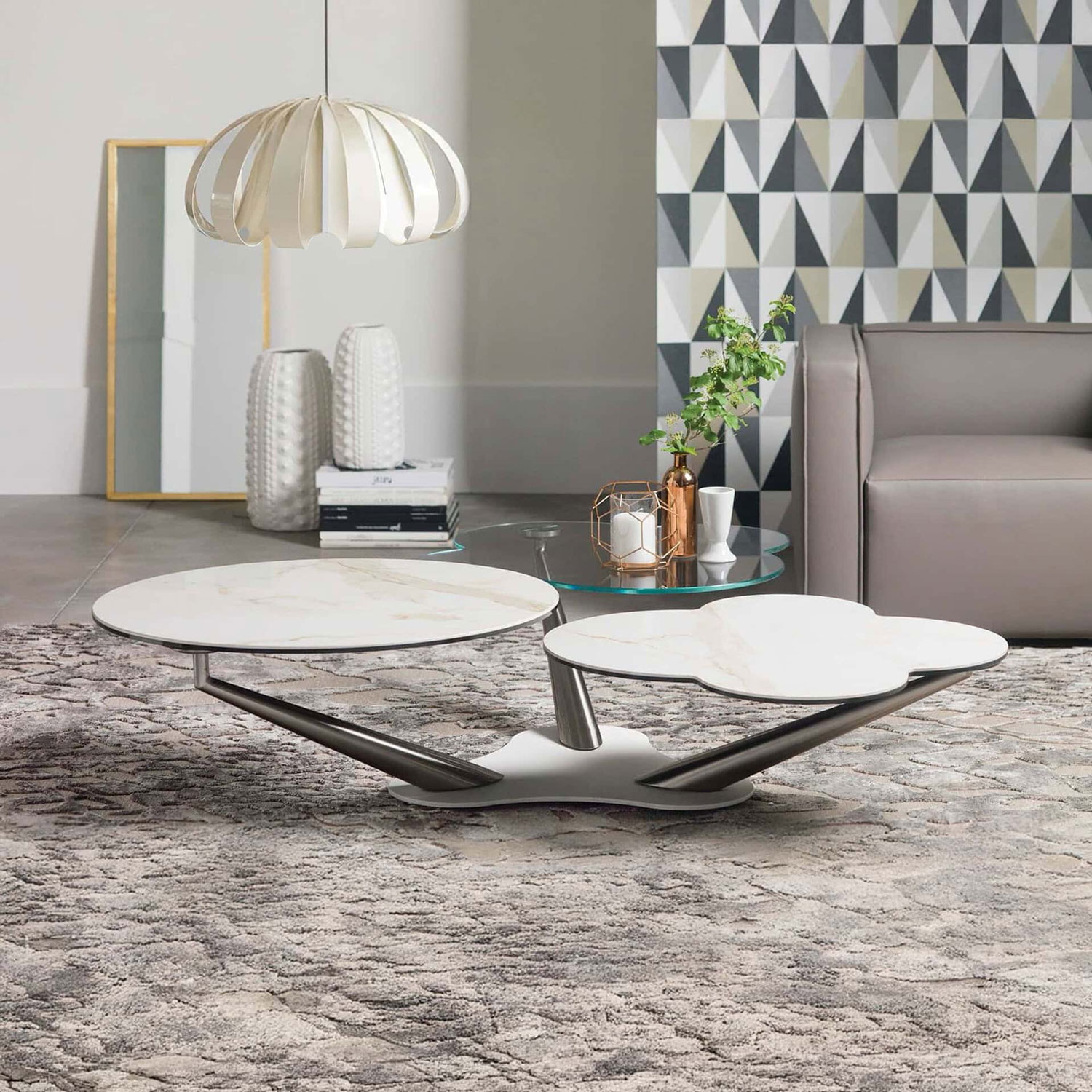 Contemporary marble coffee table with a distinctive, artistic shape in a stylish living room setting.