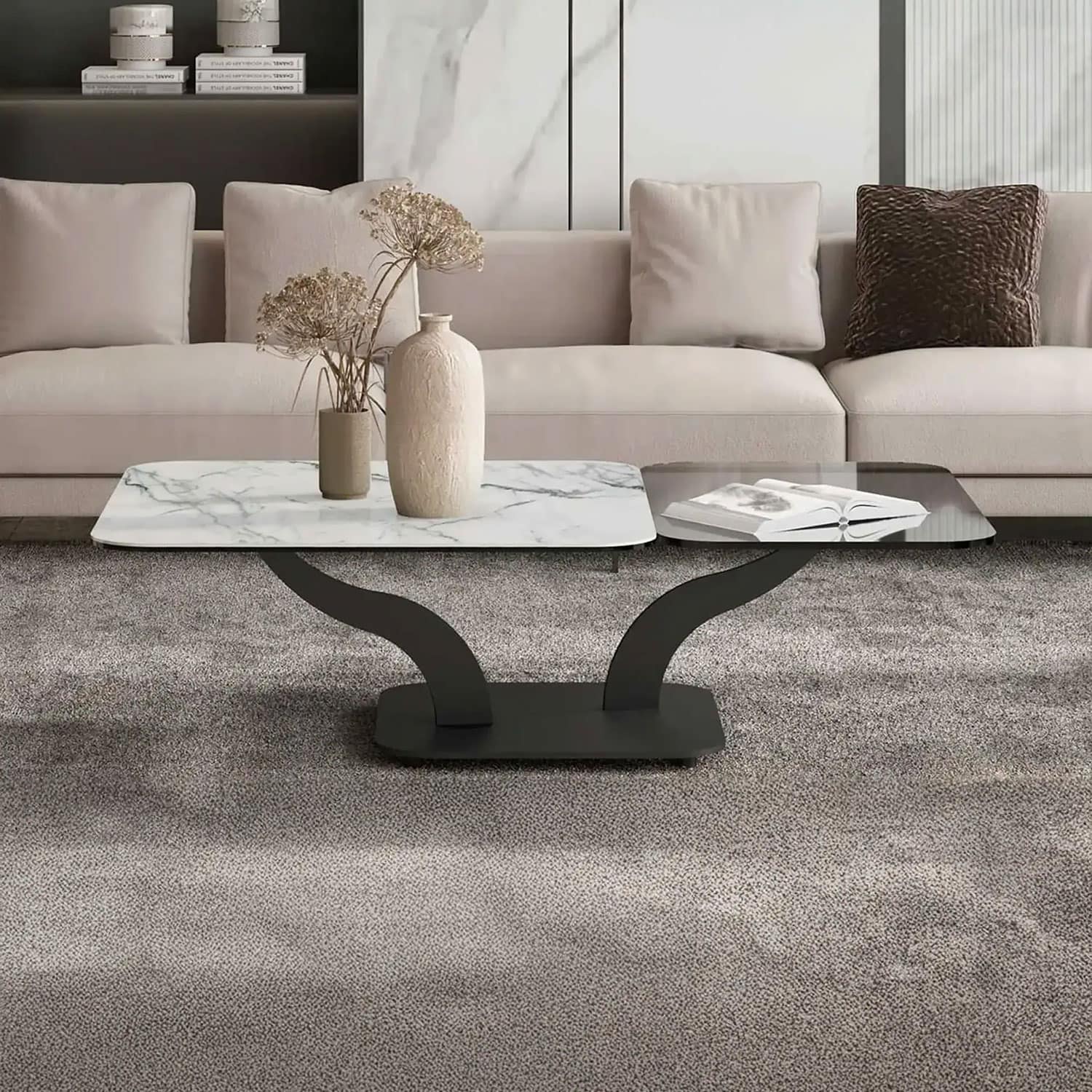 Contemporary marble coffee table with sculptural black base in stylish living room.