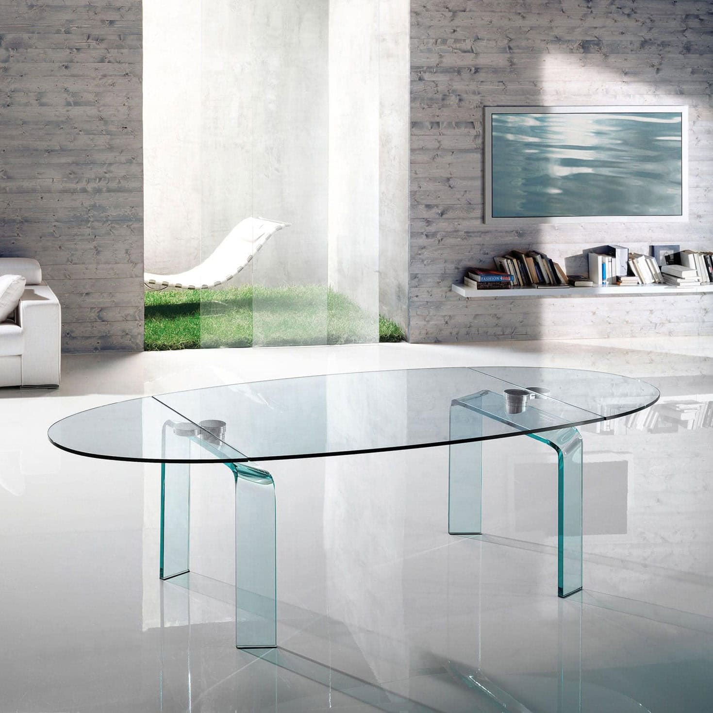 Glass dining table with sleek, transparent design in modern living space.