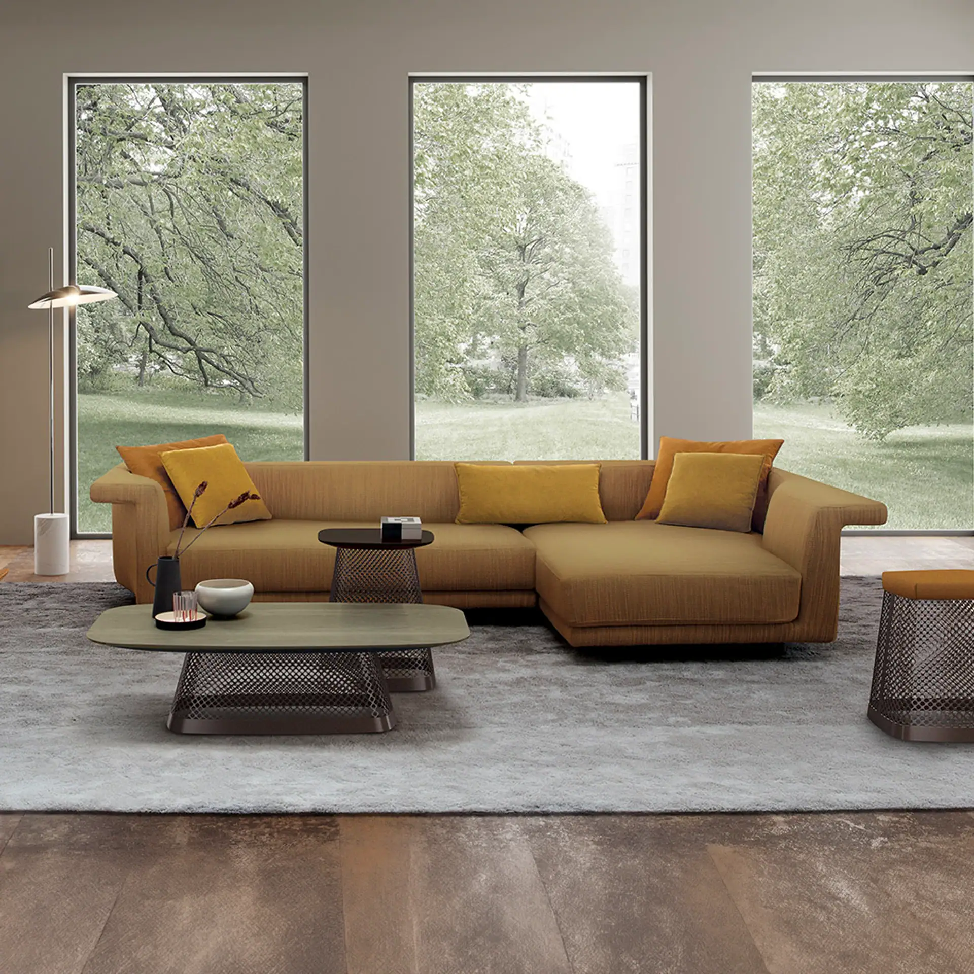 Angular sectional sofa with mustard upholstery and matching pillows.