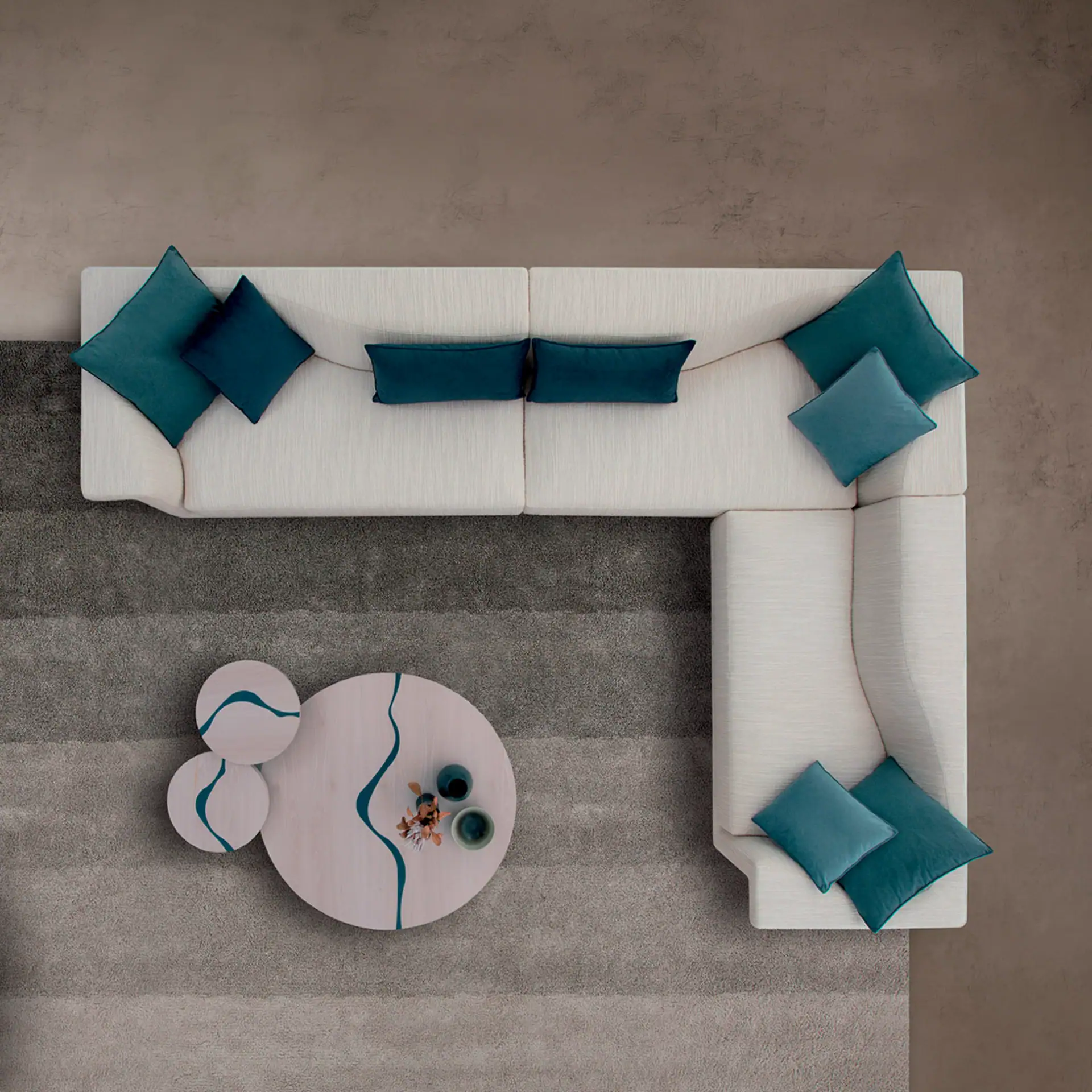 Angular sectional sofa with blue accent pillows.