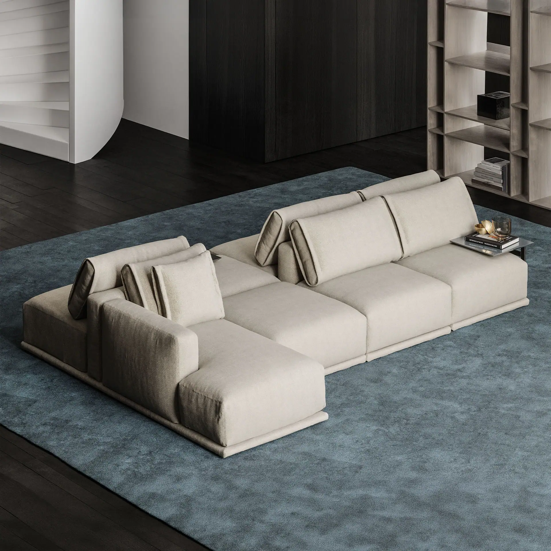Elegant double-sided sofa in neutral fabric for versatile living room seating.