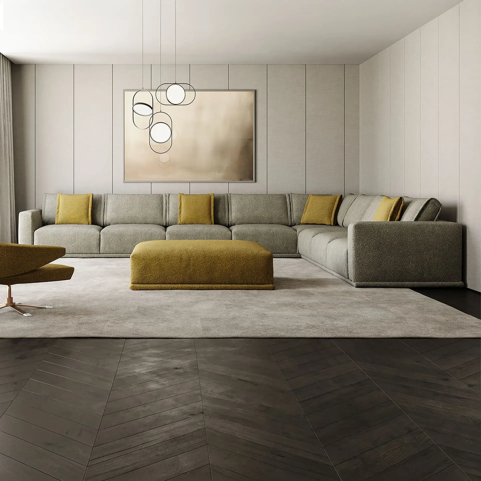 A modern living room with a grey L-shaped sofa, mustard yellow pillows and ottoman, dark wood herringbone floor, and light paneled walls with abstract art and pendant lights.