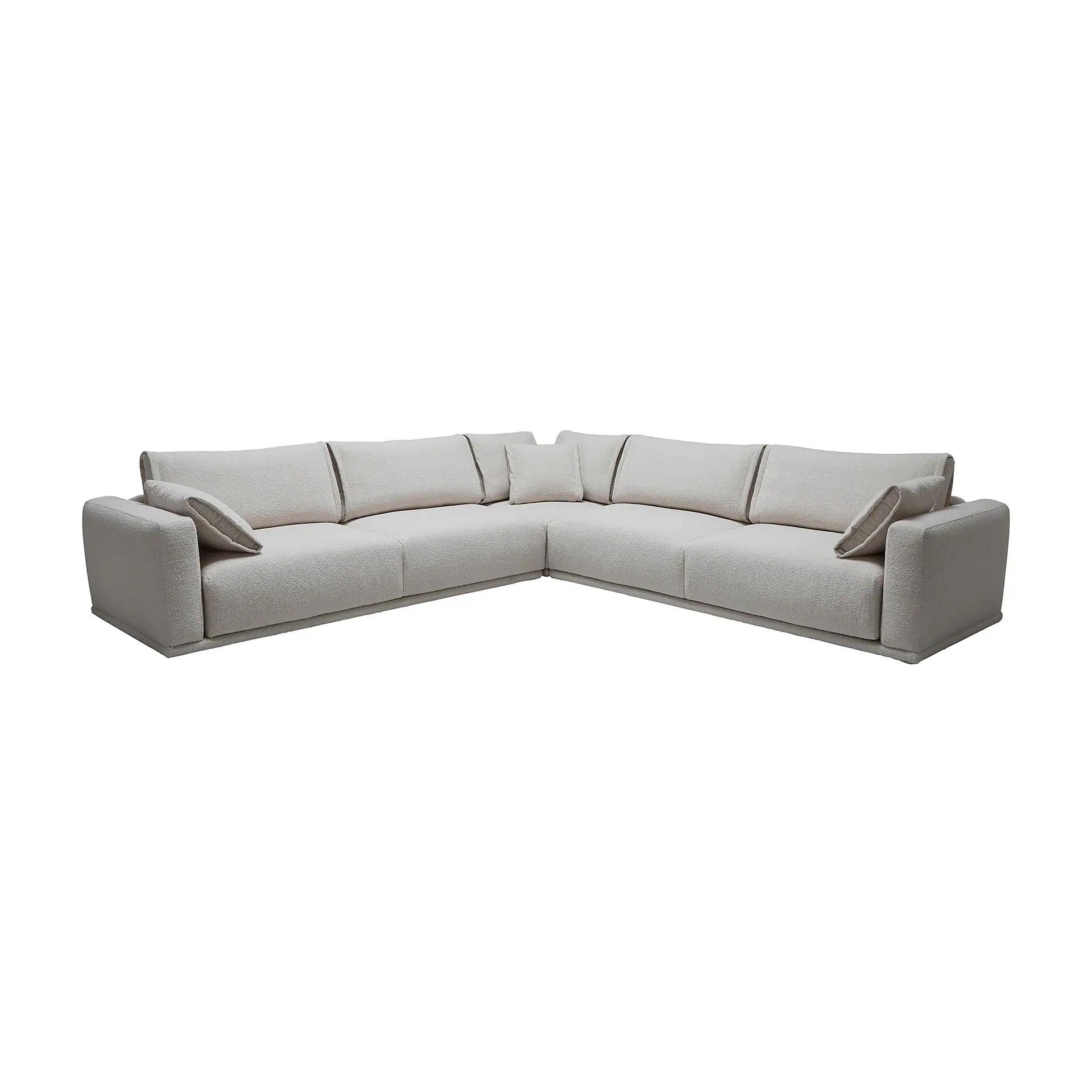 Light beige L-shaped sectional sofa with textured fabric and throw pillows on a white background.
