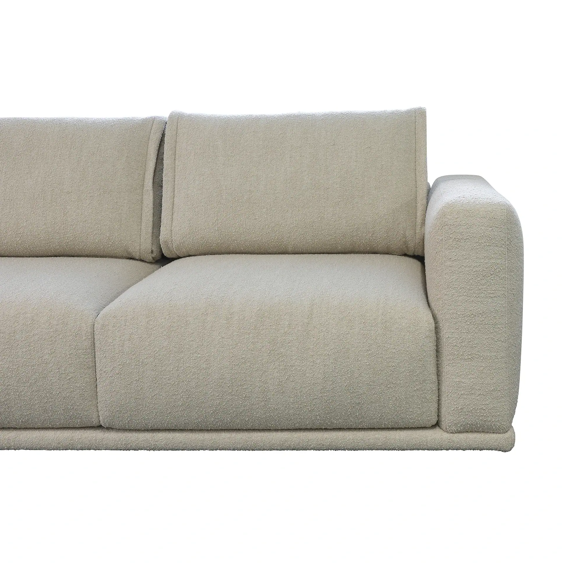 Close-up of a light beige textured sofa with two seat cushions, two back cushions, and a rounded armrest on the right, against a white background.
