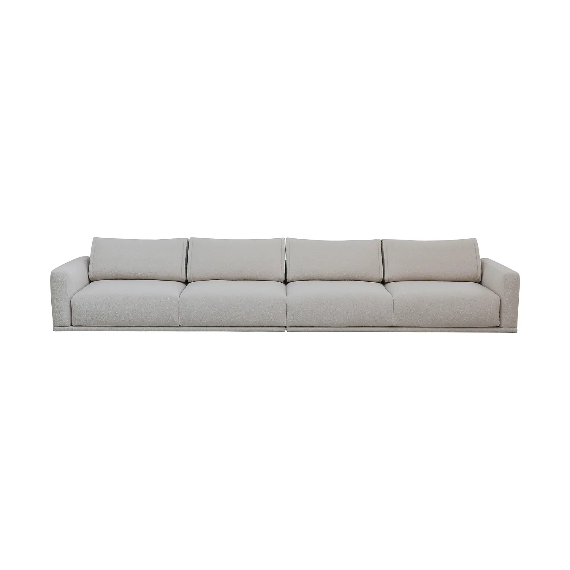 A long, light beige modular sofa with textured fabric, composed of four sections, on a white background.