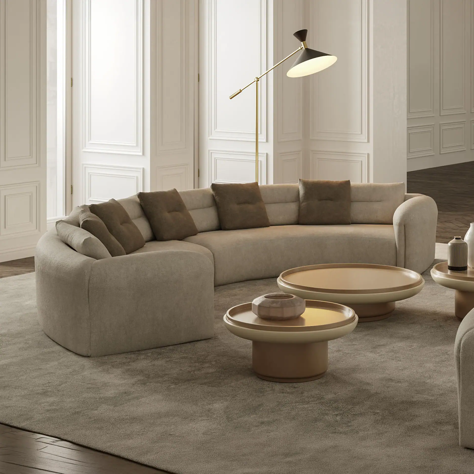 Elegant curved sectional sofa with plush cushions in a sophisticated living room setting.