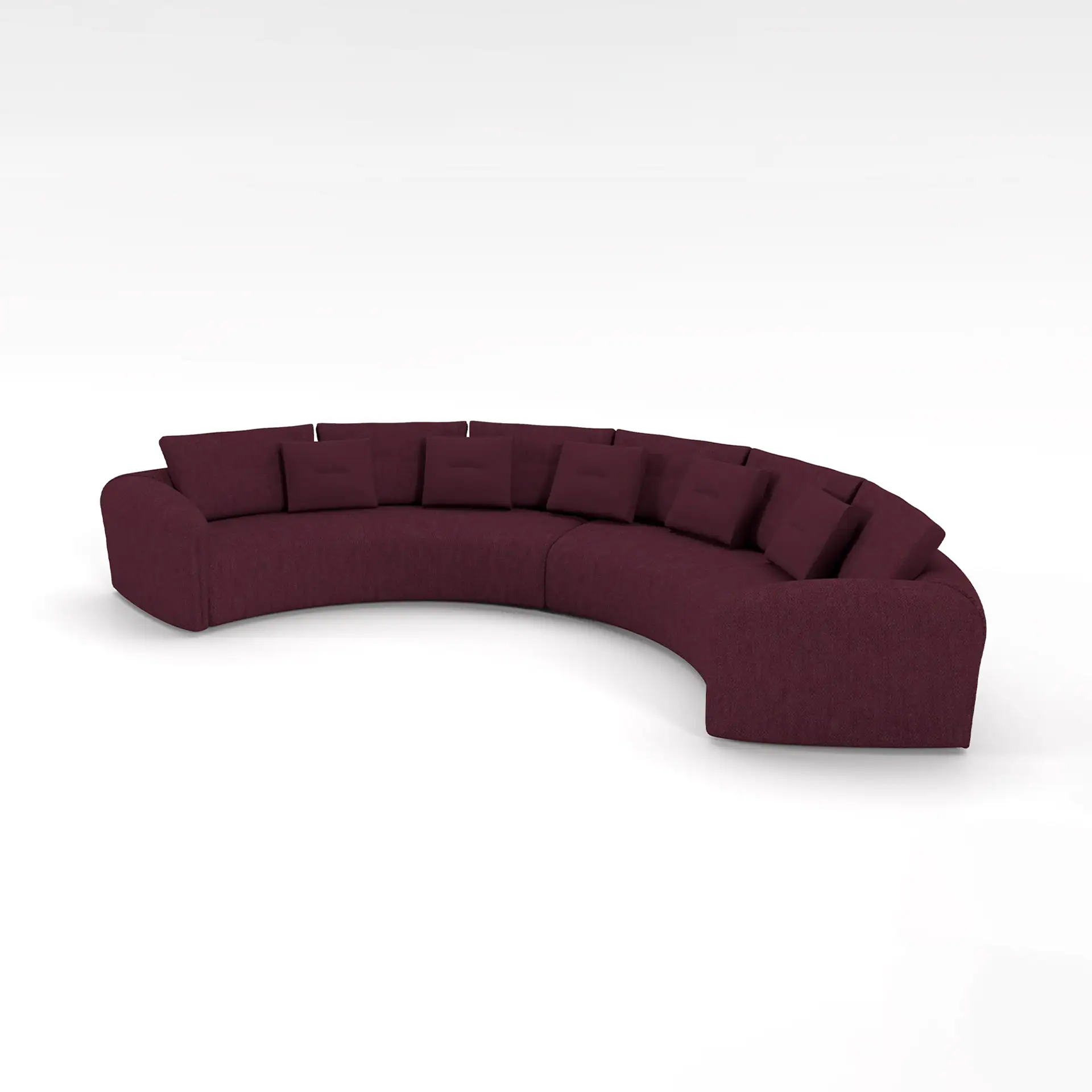 Luxurious curved sectional sofa in deep burgundy fabric for modern living rooms.