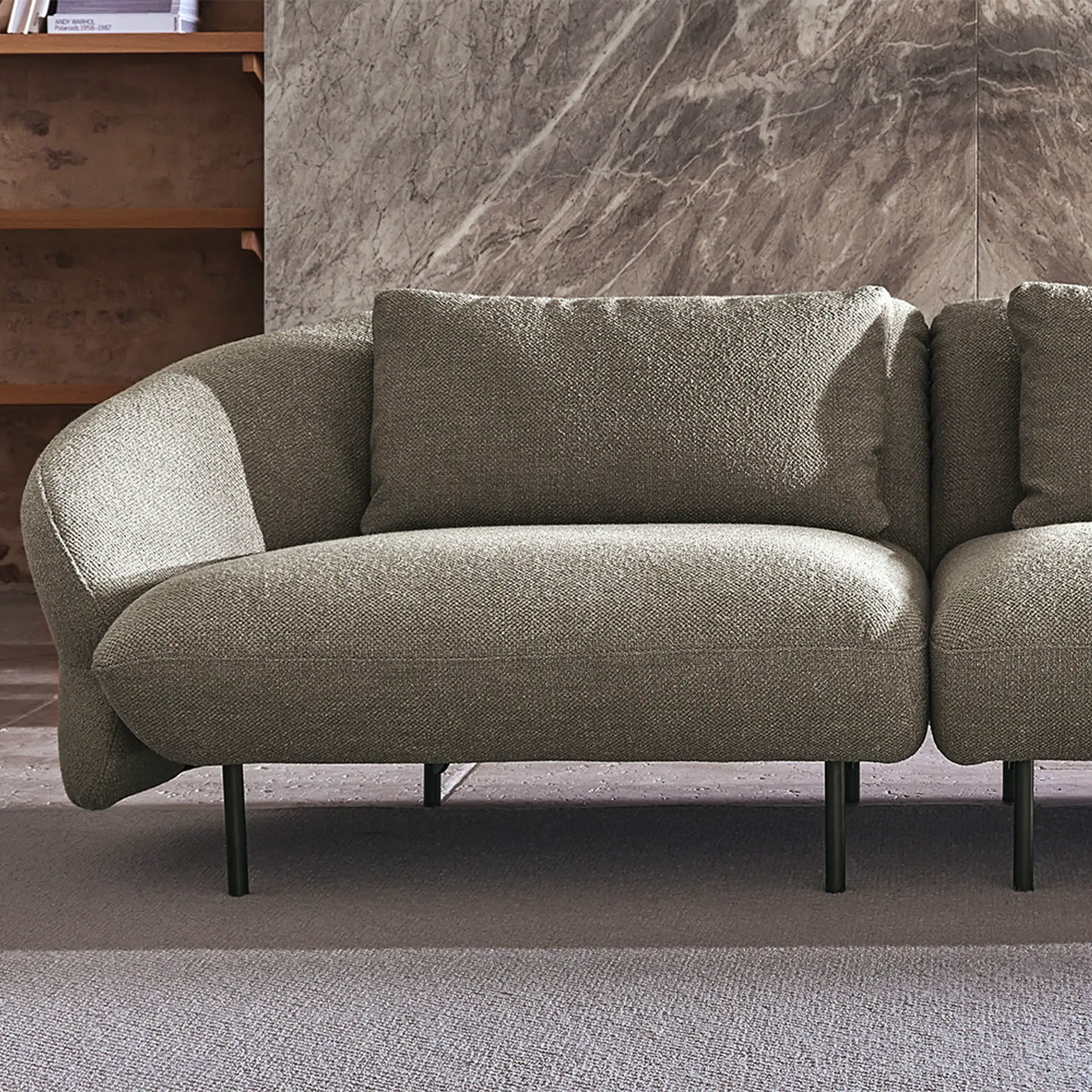 Fleur Modular Sofa in neutral fabric with sleek black legs, perfect for modern living spaces.