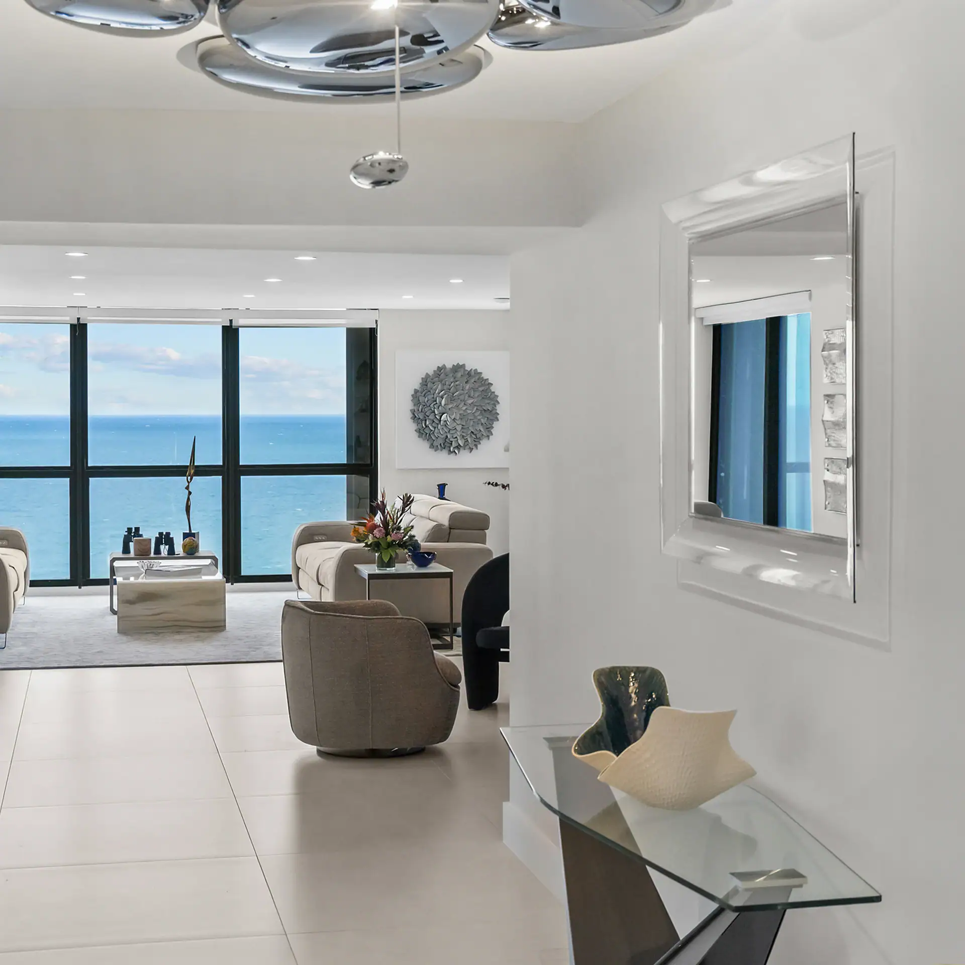 Modern ocean-view living room with stylish furniture and contemporary decor.