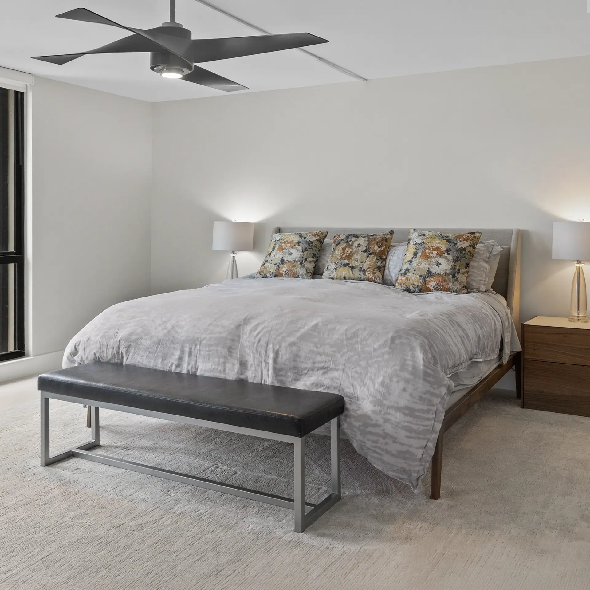 Elegant bedroom with contemporary furniture, soft lighting, and a cozy atmosphere.
