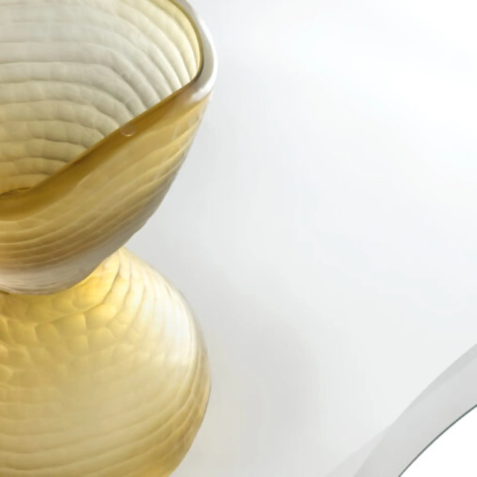 Elegant Murano glass vase with a golden finish, perfect for modern dining room decor.