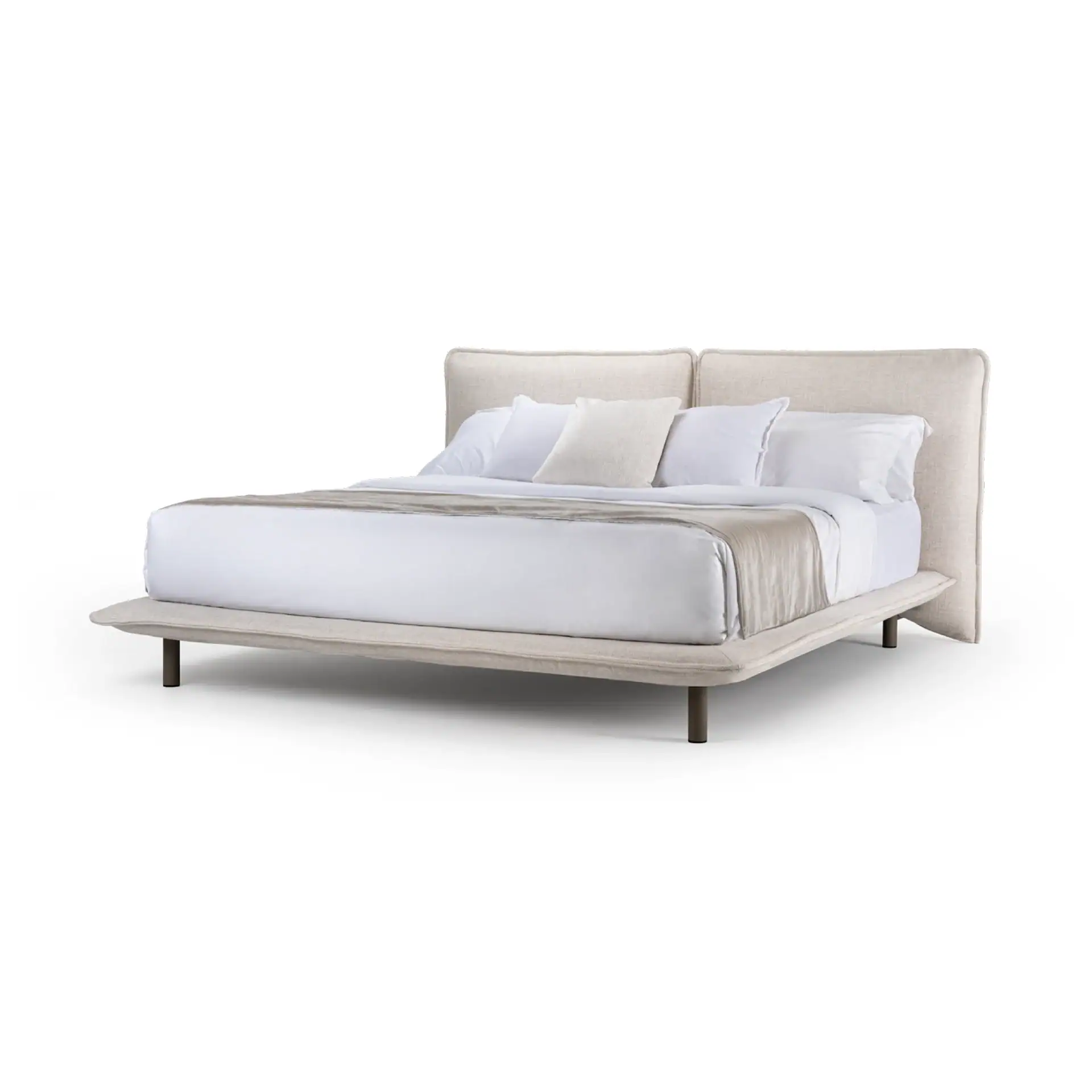 Haven upholstered bed with white bedding and pillows in a bedroom setting.