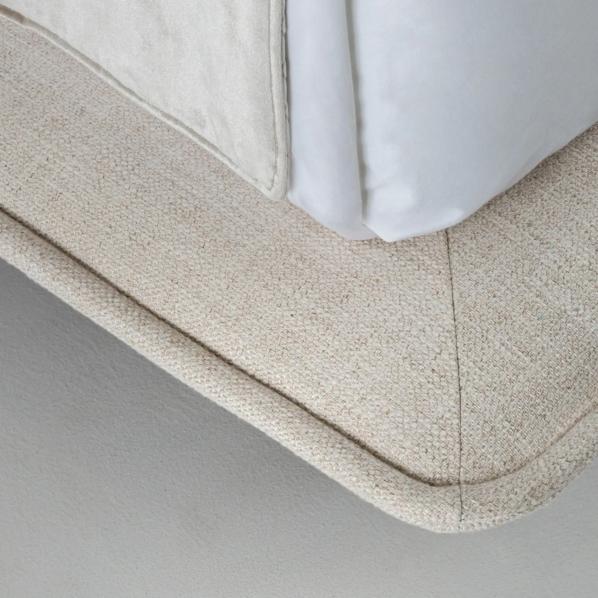 Close-up of Haven Upholstered Bed corner showing fabric and construction details.