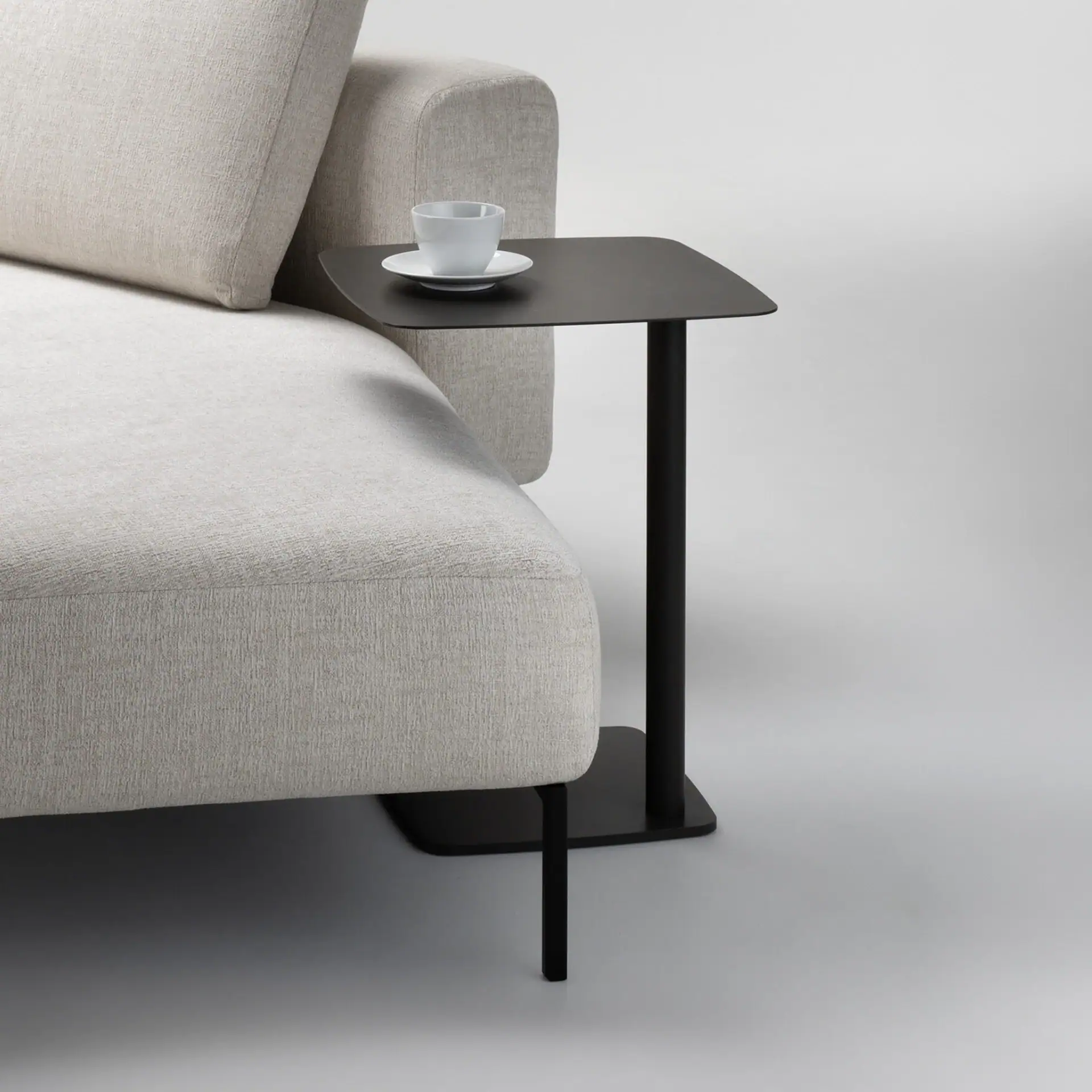 Sklar Furnishings Leo Accent Table with cup and saucer on top.