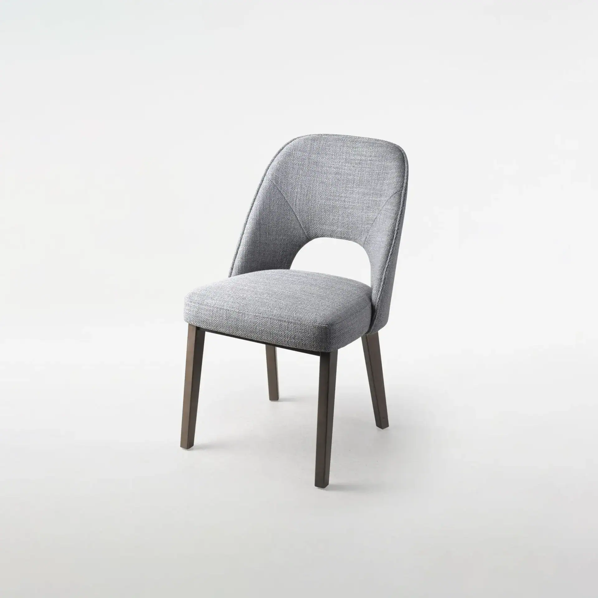 Stylish Mia dining chair with upholstered seat and wooden legs for contemporary dining rooms.