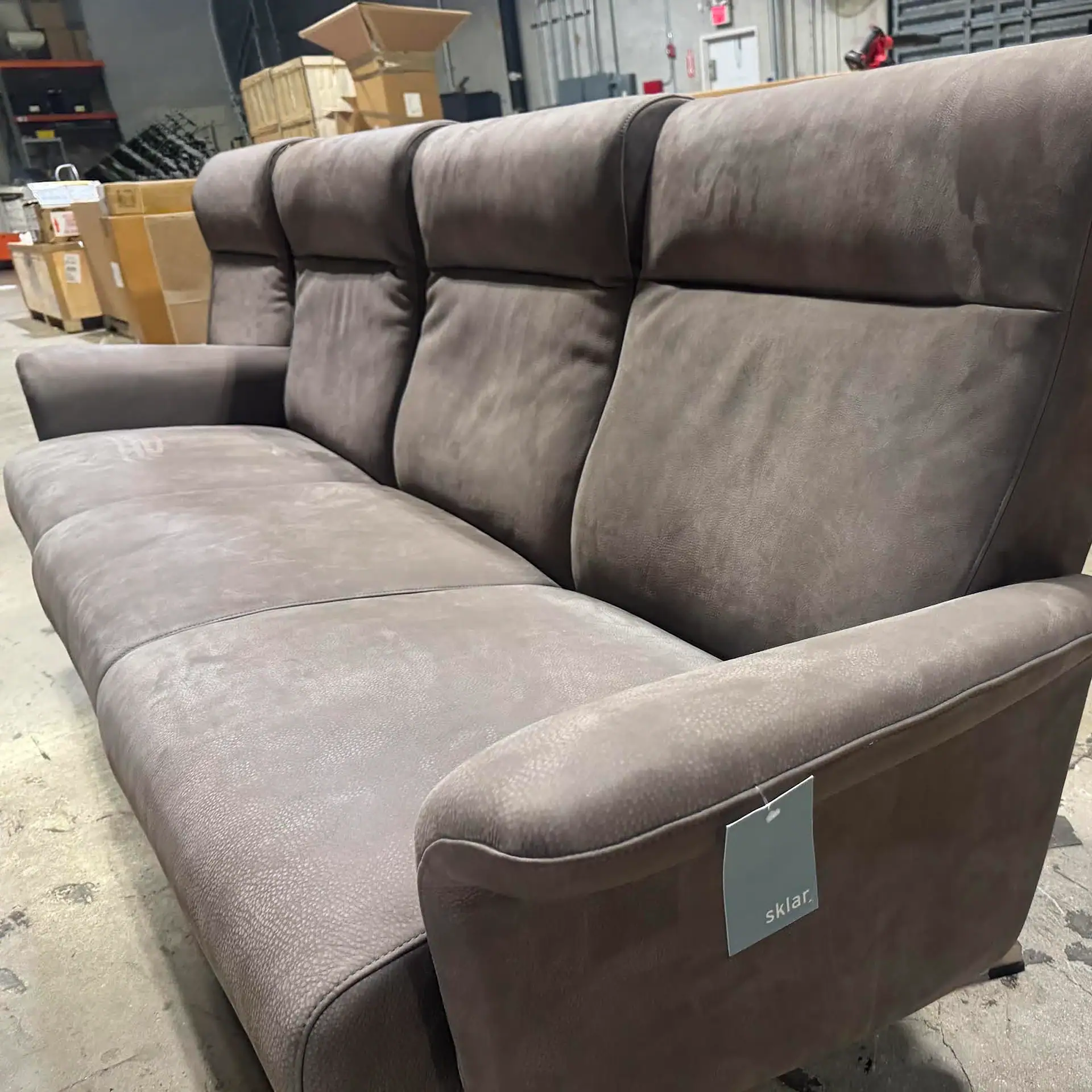 Sklar Furnishings Harlowe 3-Seat Sofa in a warehouse setting.