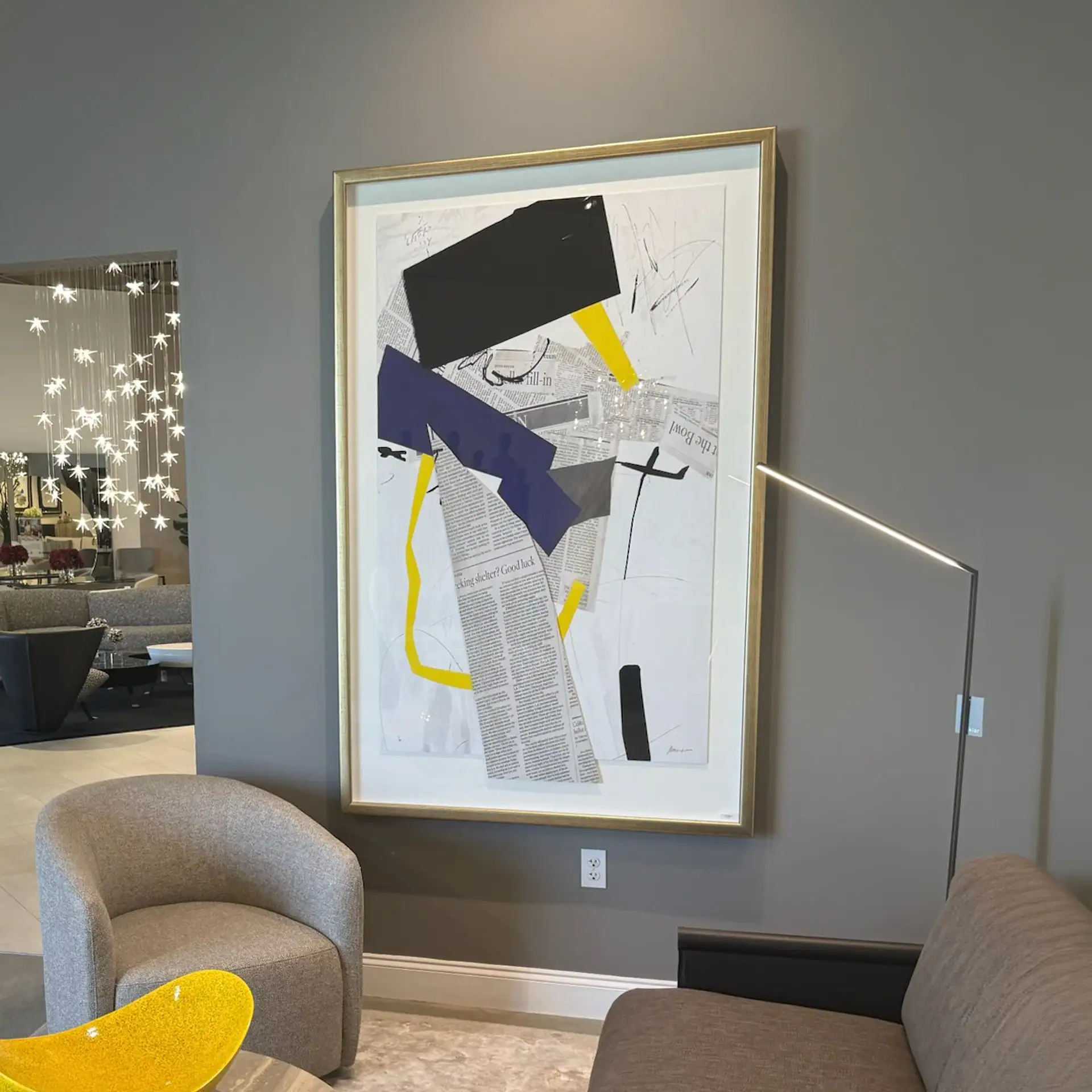 Abstract wall art with geometric shapes and newspaper collage, enhancing contemporary interior decor.
