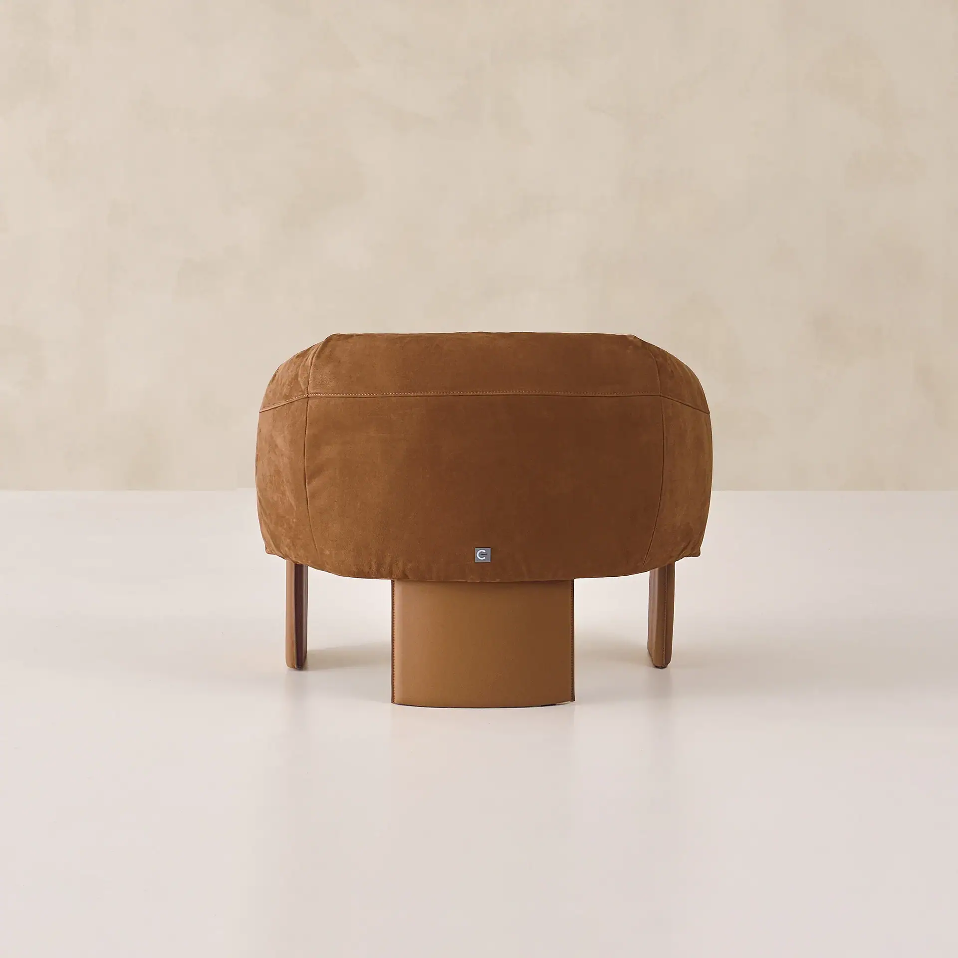 Modern brown Bella armchair by Sklar Furnishings with unique design.