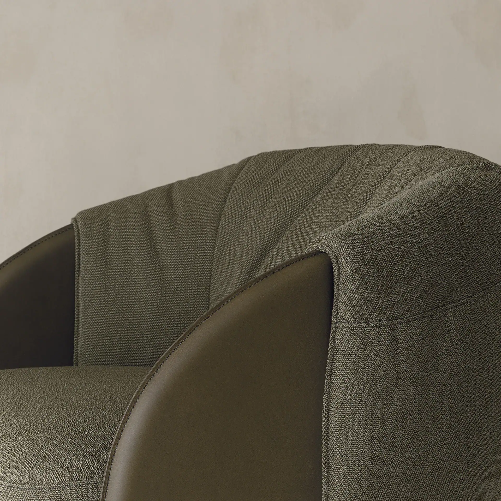 Elegant Bella armchair with dark leather arms and textured fabric upholstery.