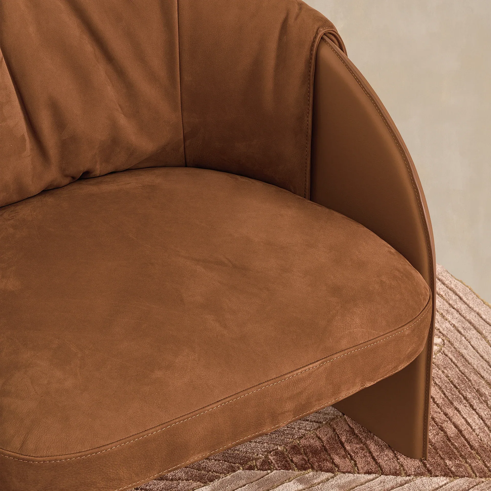 Sklar Furnishings armchair seat and curved armrest in brown suede.