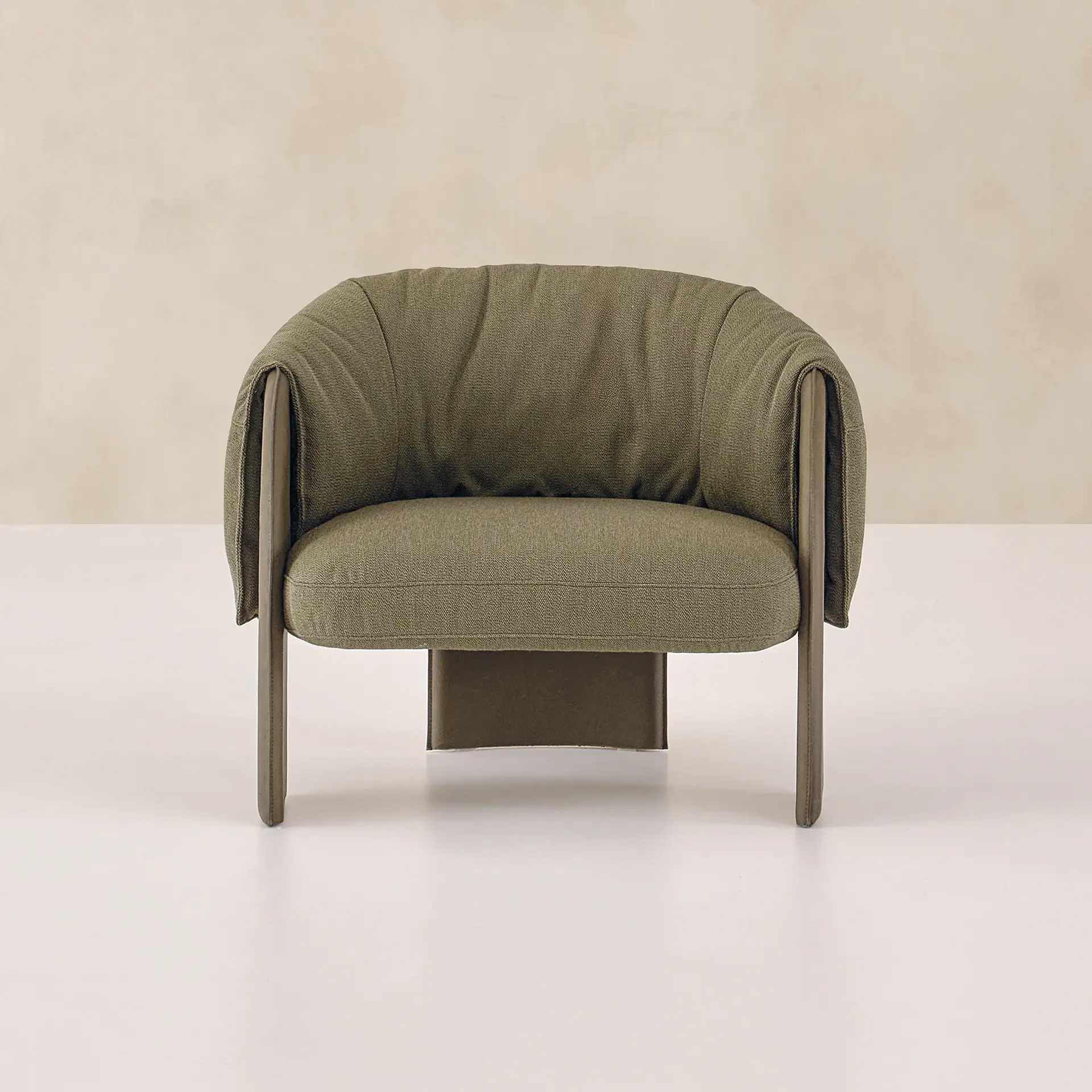 Sklar Bella Armchair in olive fabric with modern rounded silhouette.