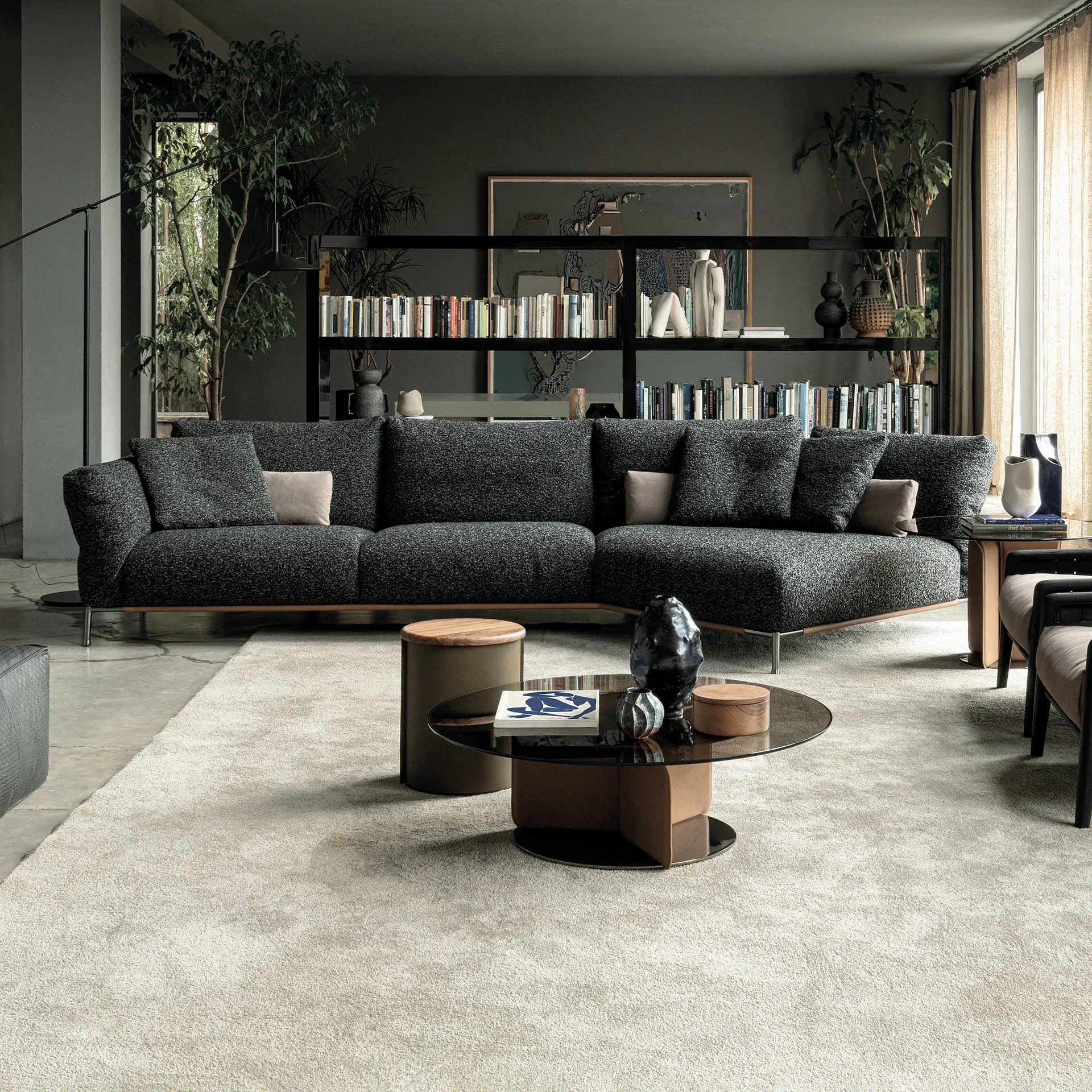 Sklar Furnishings dark gray modular sofa in a contemporary living room.