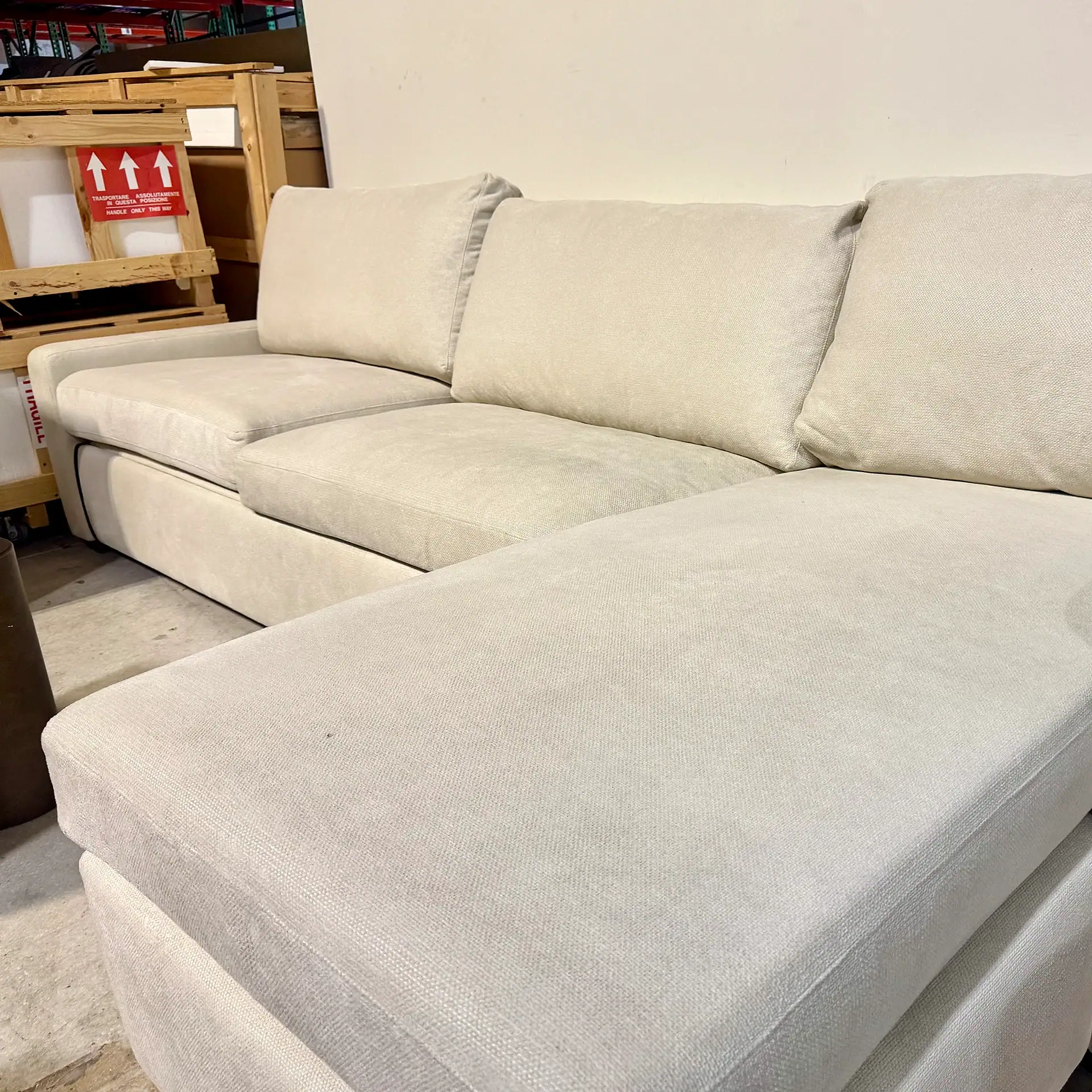 Light beige American Leather Lyons sleeper sofa in a showroom setting.