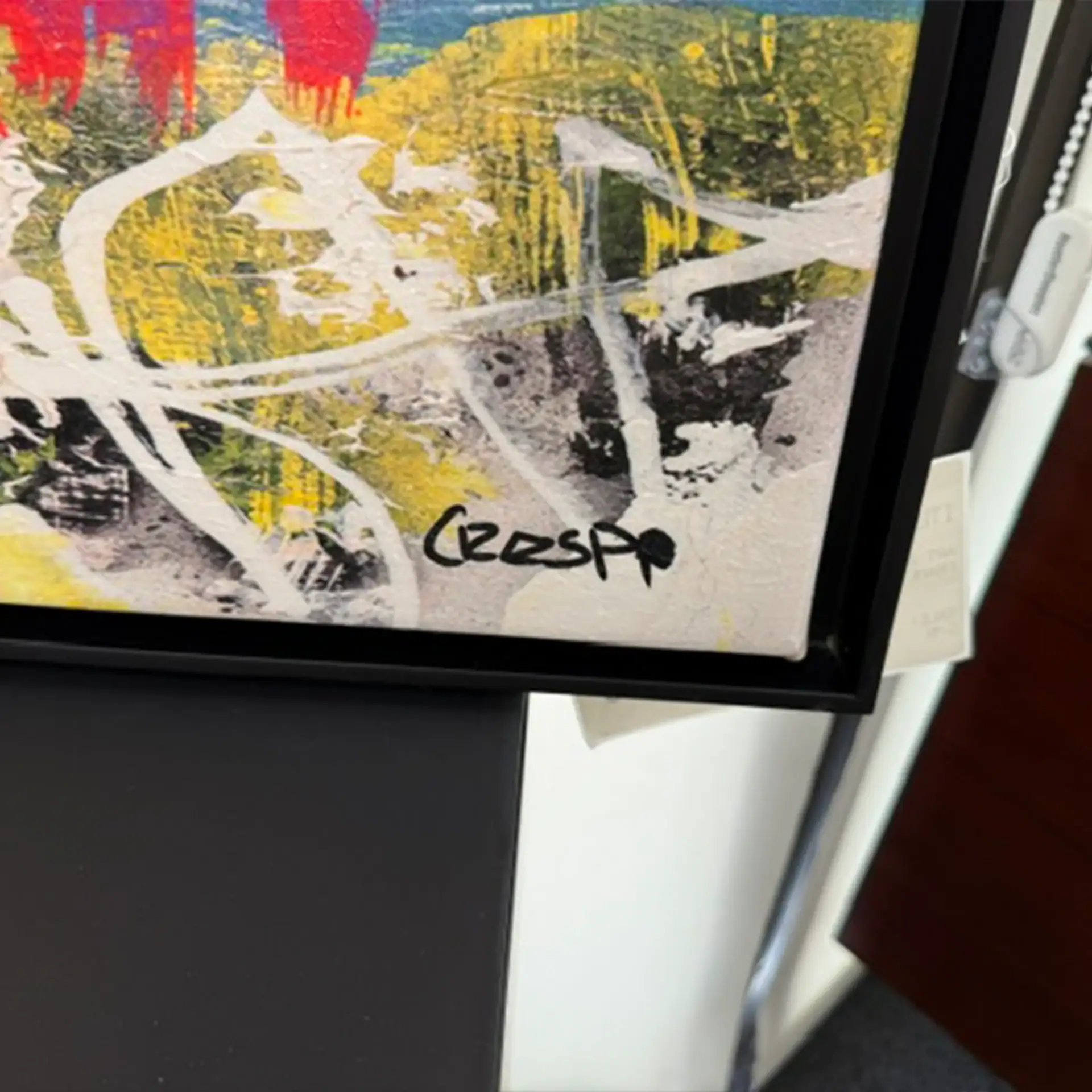 Abstract wall art titled 'Chasing Rays' with vibrant yellow, black, and white colors.