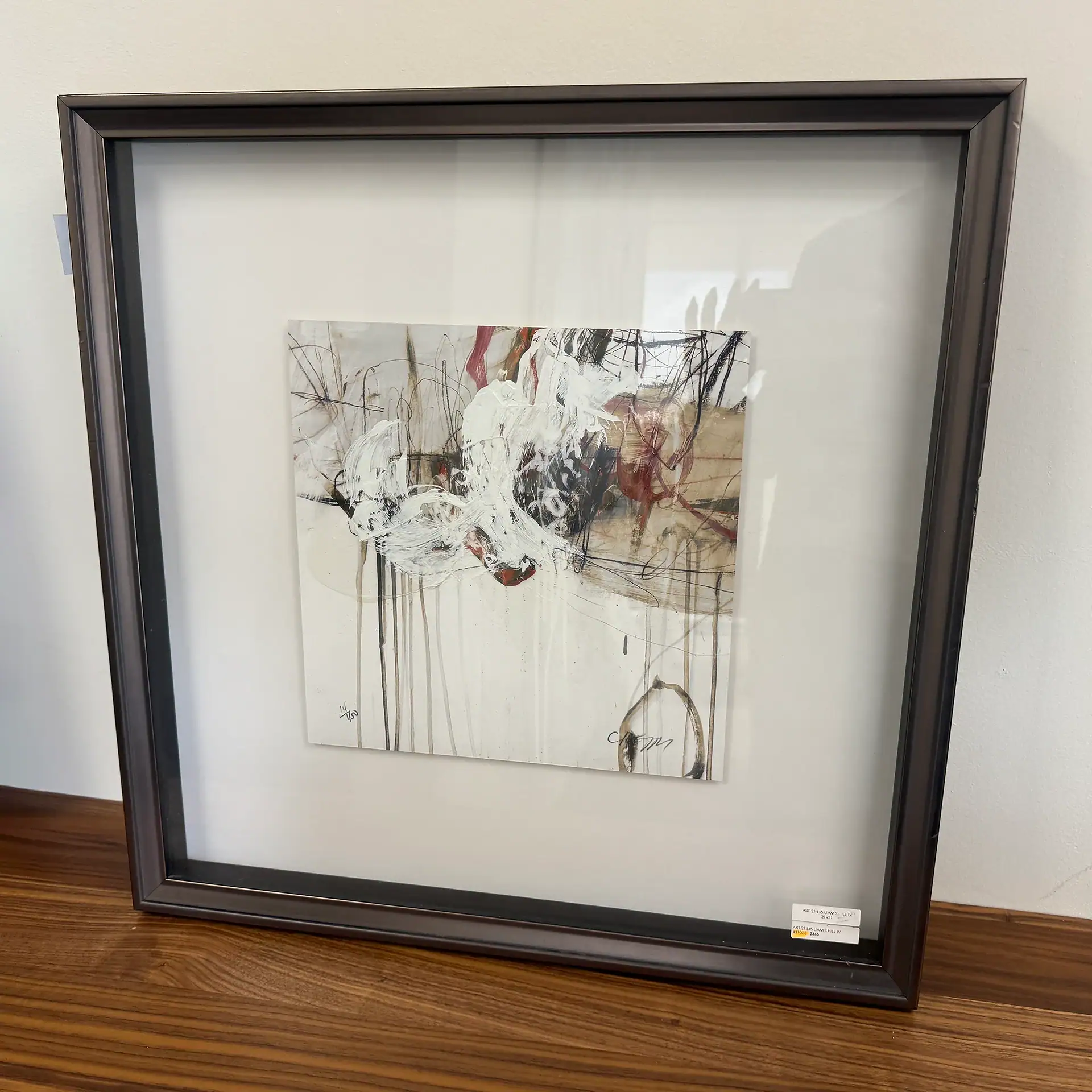Contemporary abstract wall art with black frame, perfect for modern interior decor.