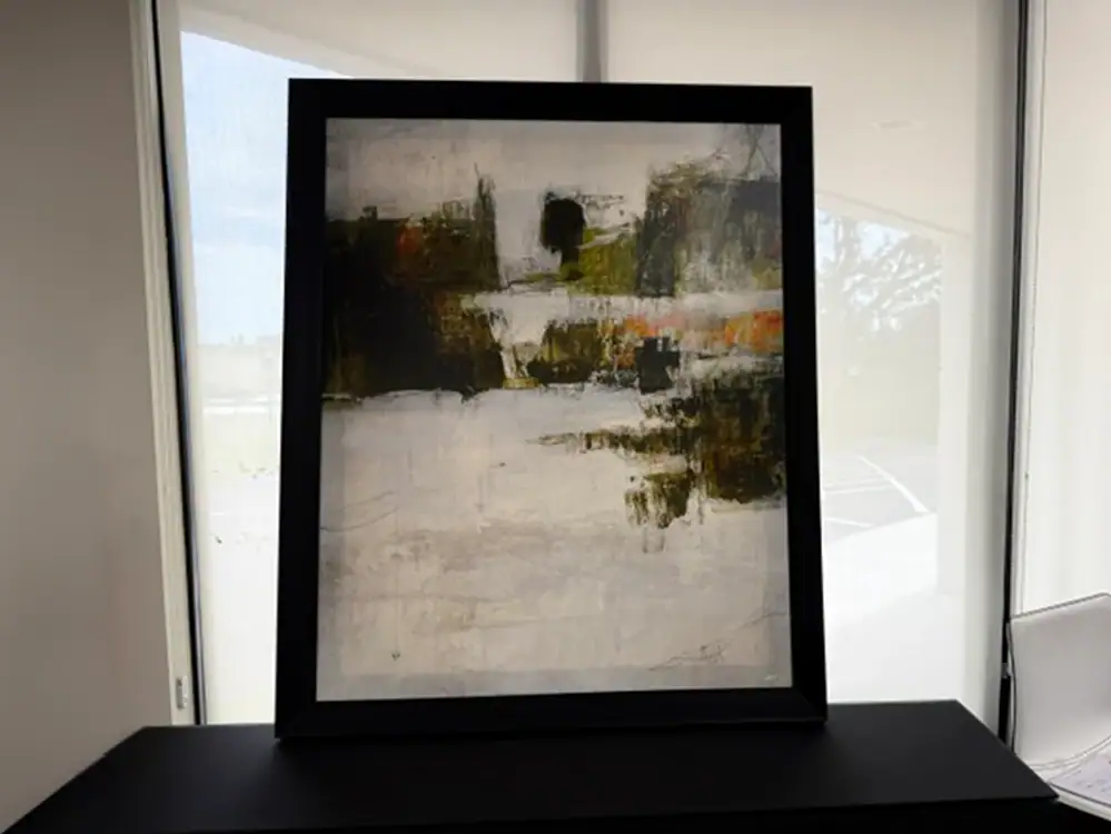 Contemporary abstract wall art in black frame for home decor.