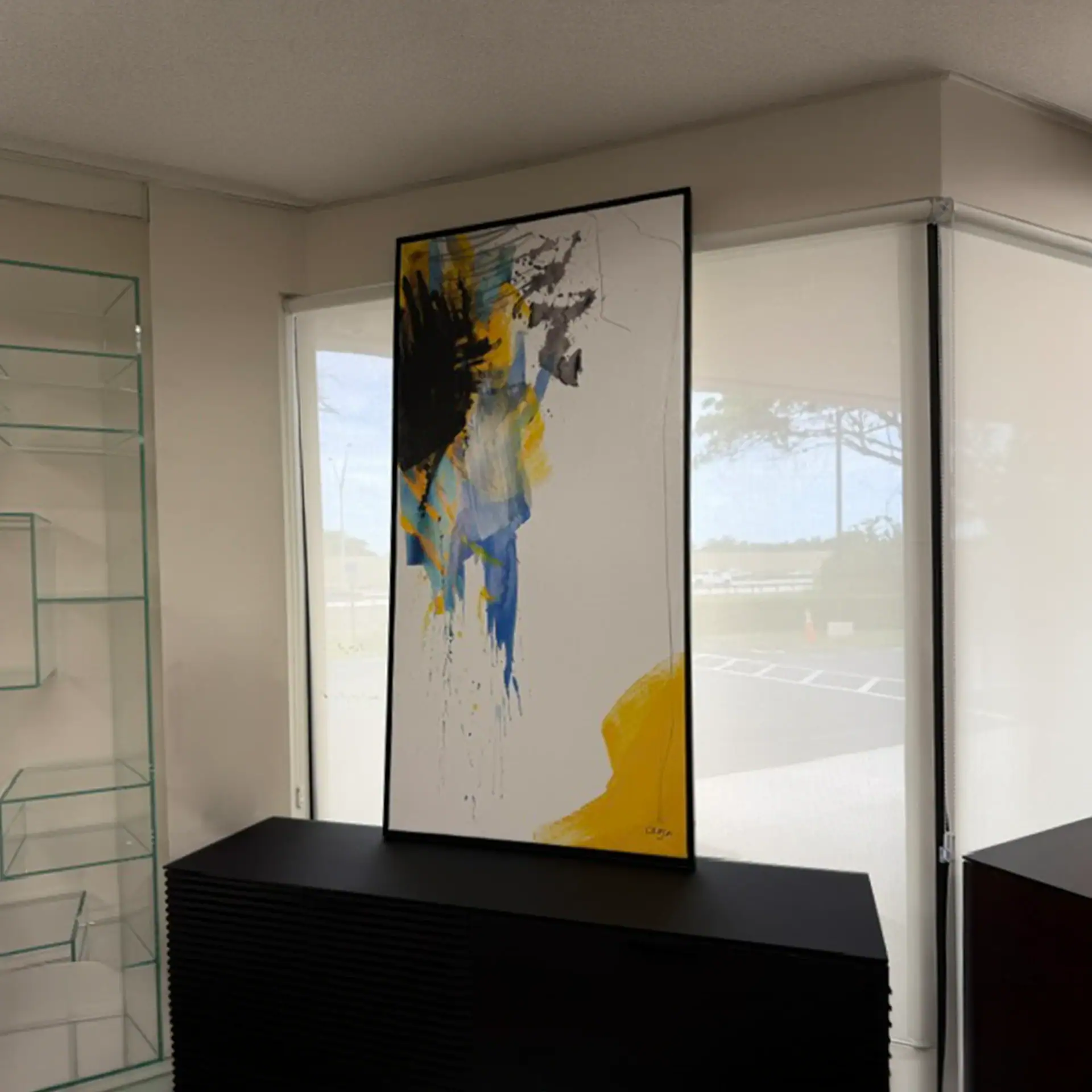 Colorful abstract wall art in a contemporary interior setting.