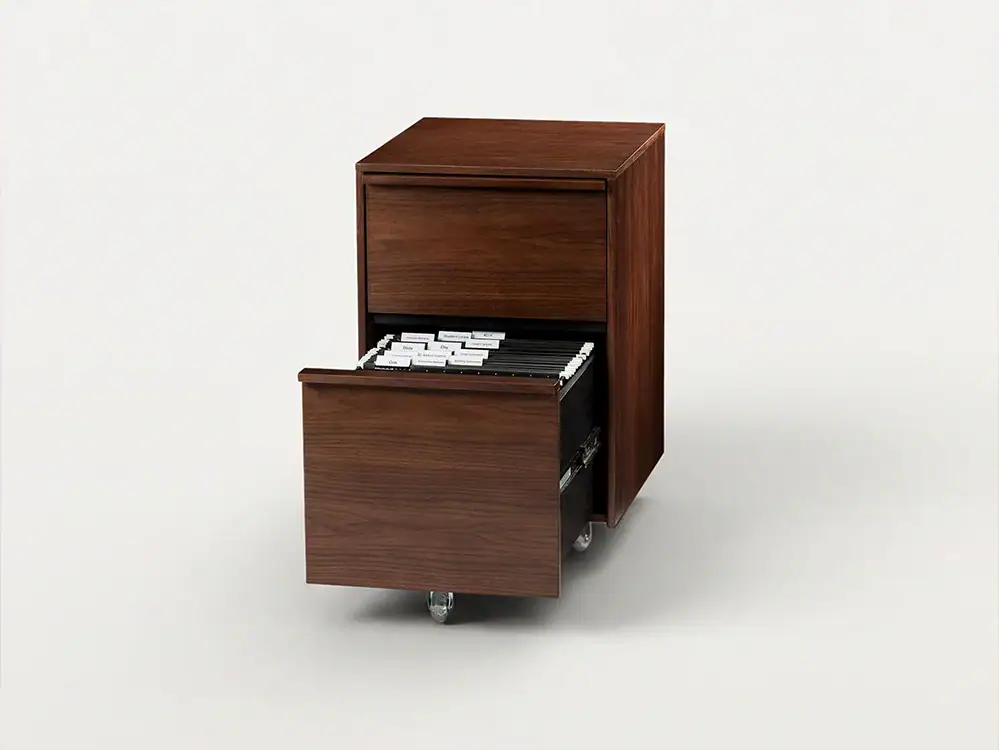 Wooden pedestal drawer unit with open drawer on casters for office storage.