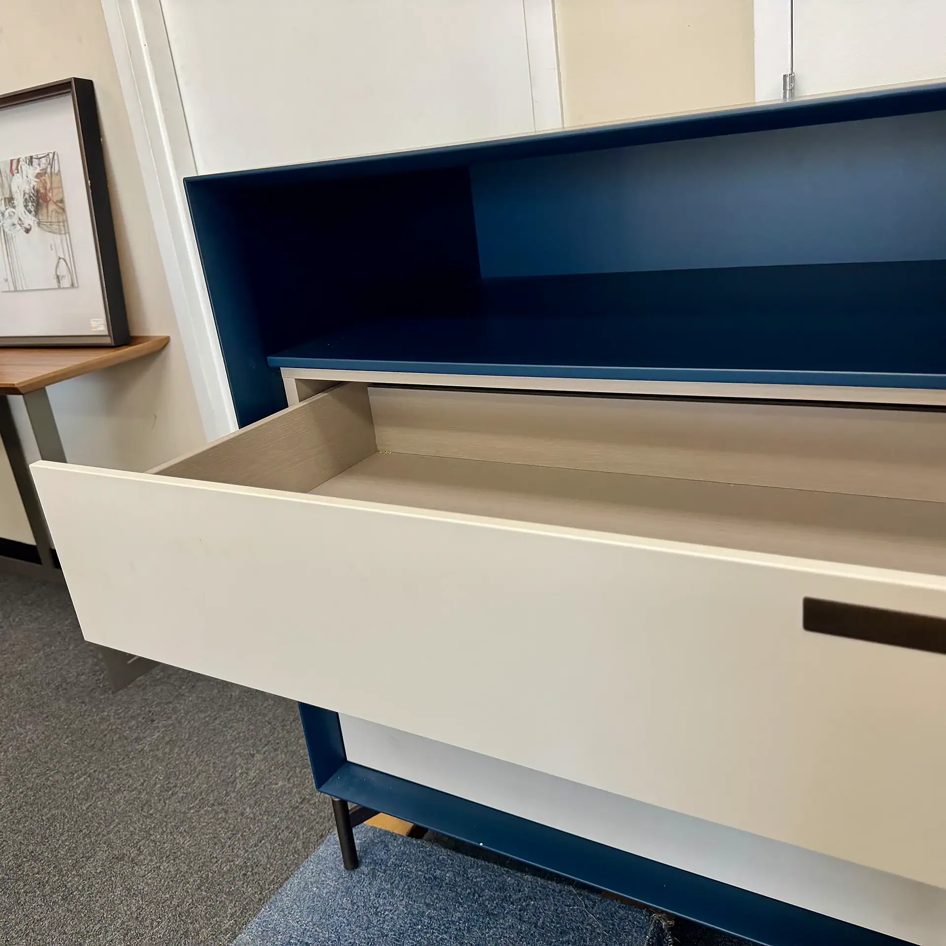 Modern Jesse Contigo 3-Drawer Dresser with open drawer and blue finish.