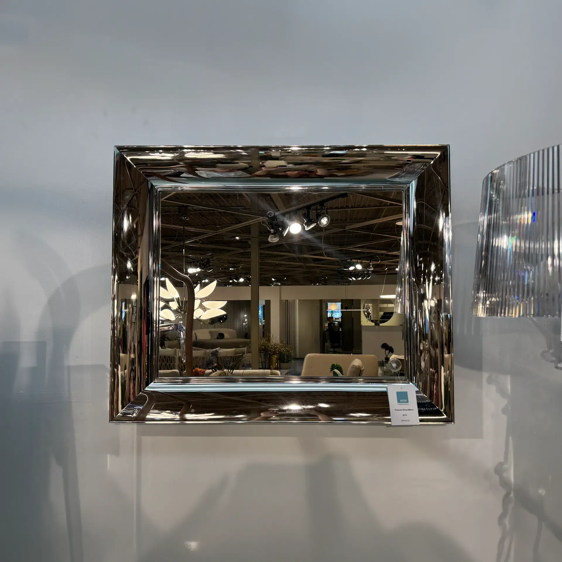 Small Kartell François Ghost Mirror with reflective surface and modern design.
