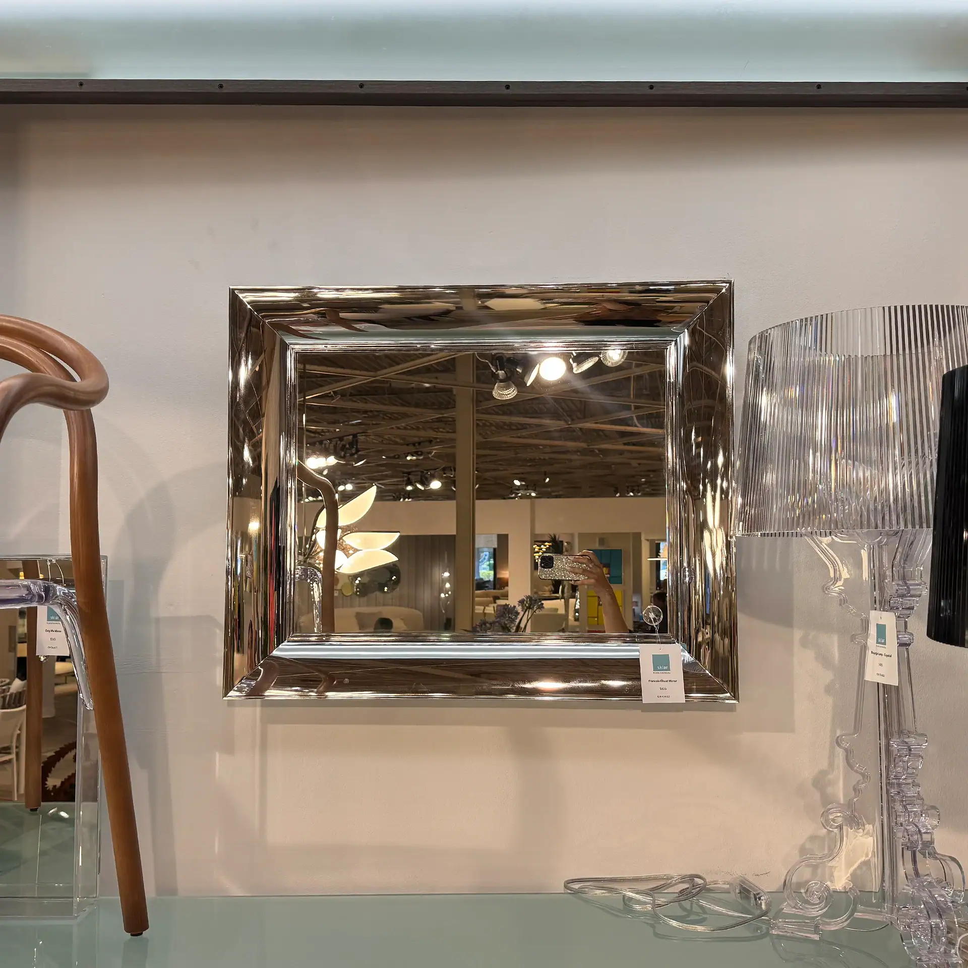 Small Kartell François Ghost Mirror with reflective silver frame.