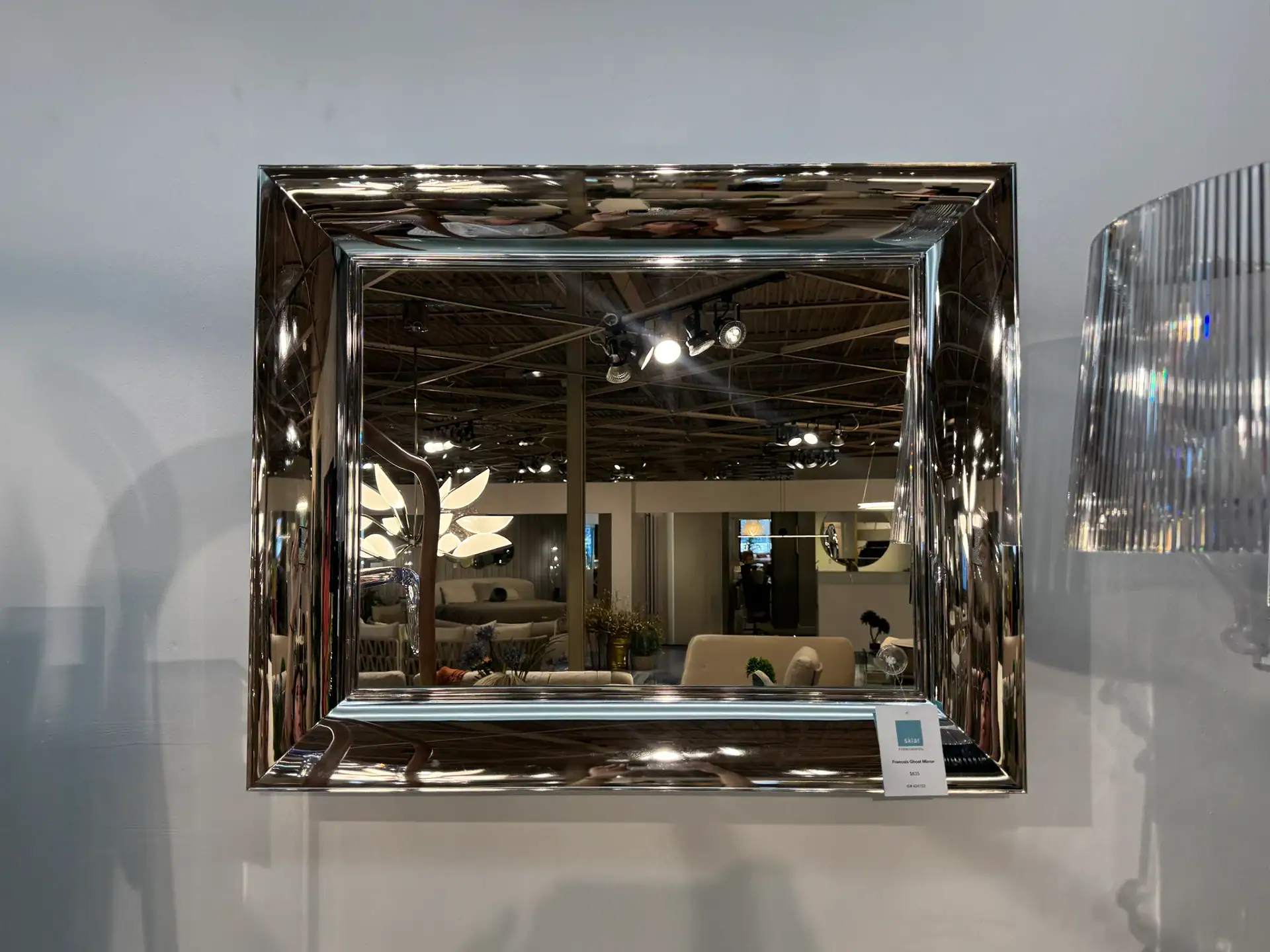 Small Kartell François Ghost Mirror with reflective frame for modern decor.