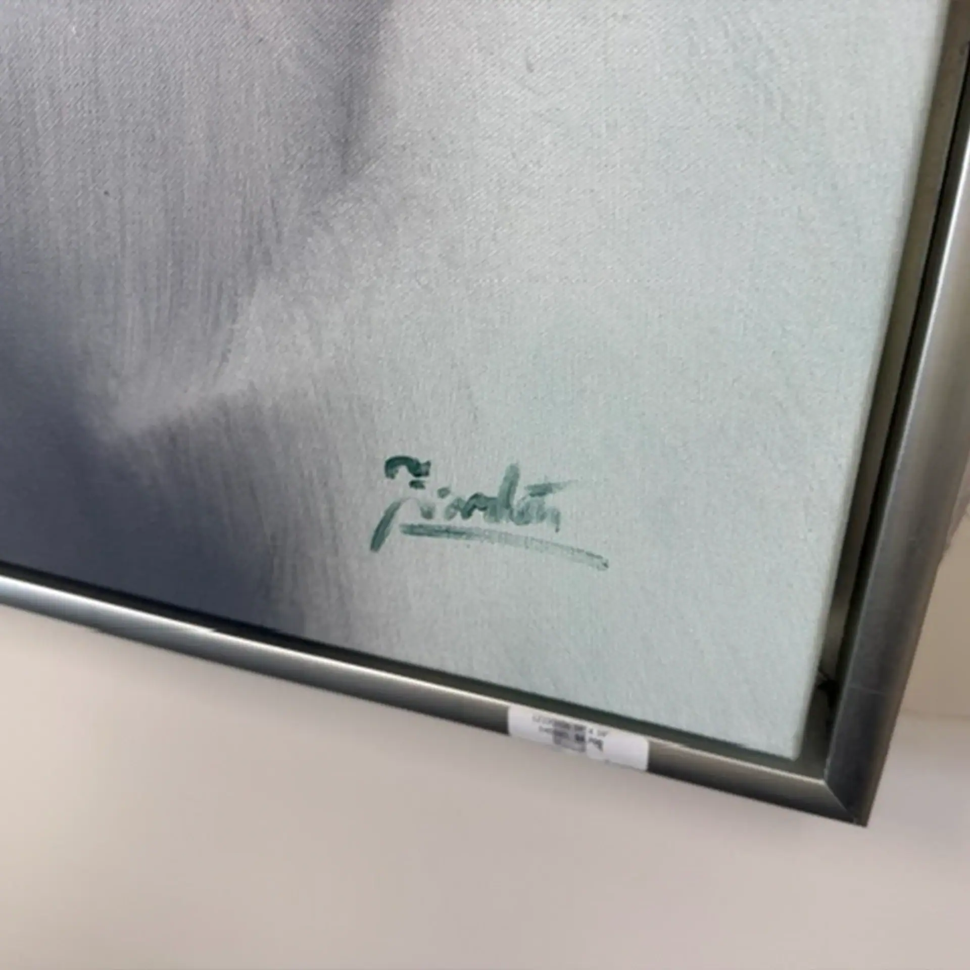 Close-up of Sklar Furnishings signature on wall art piece.