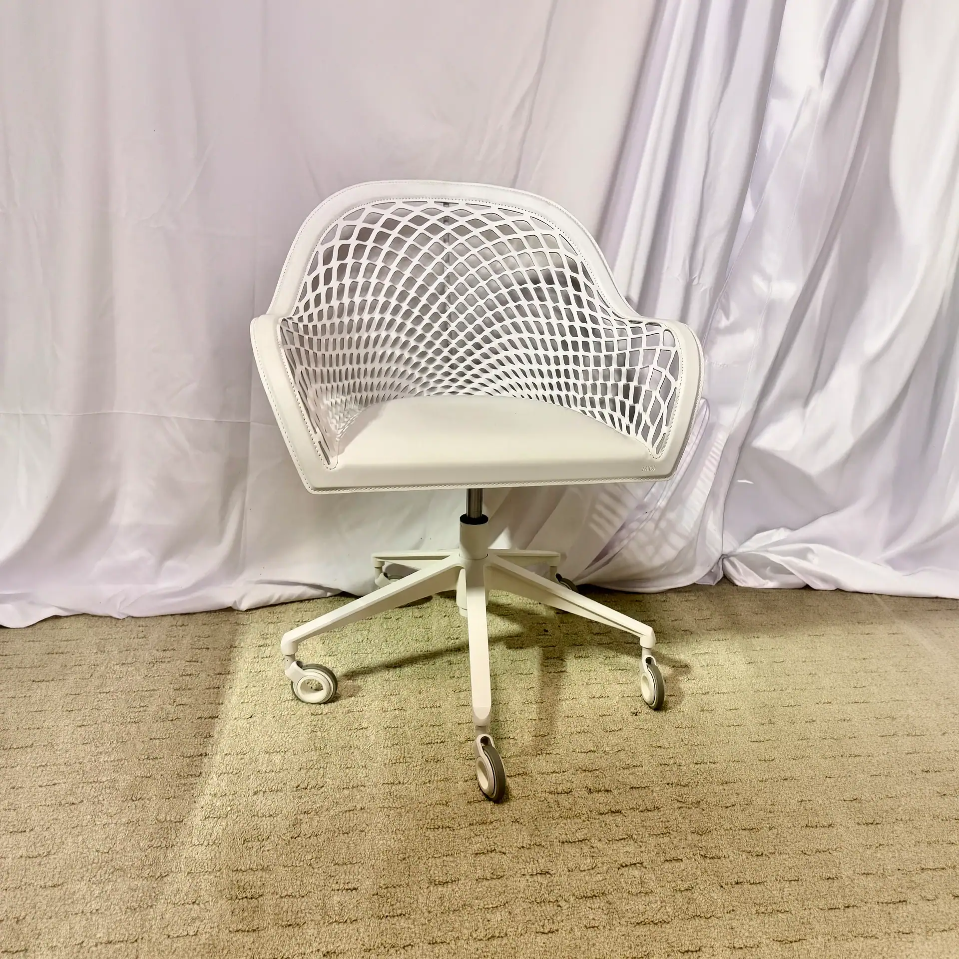 Modern white office chair with a mesh back and swivel base.